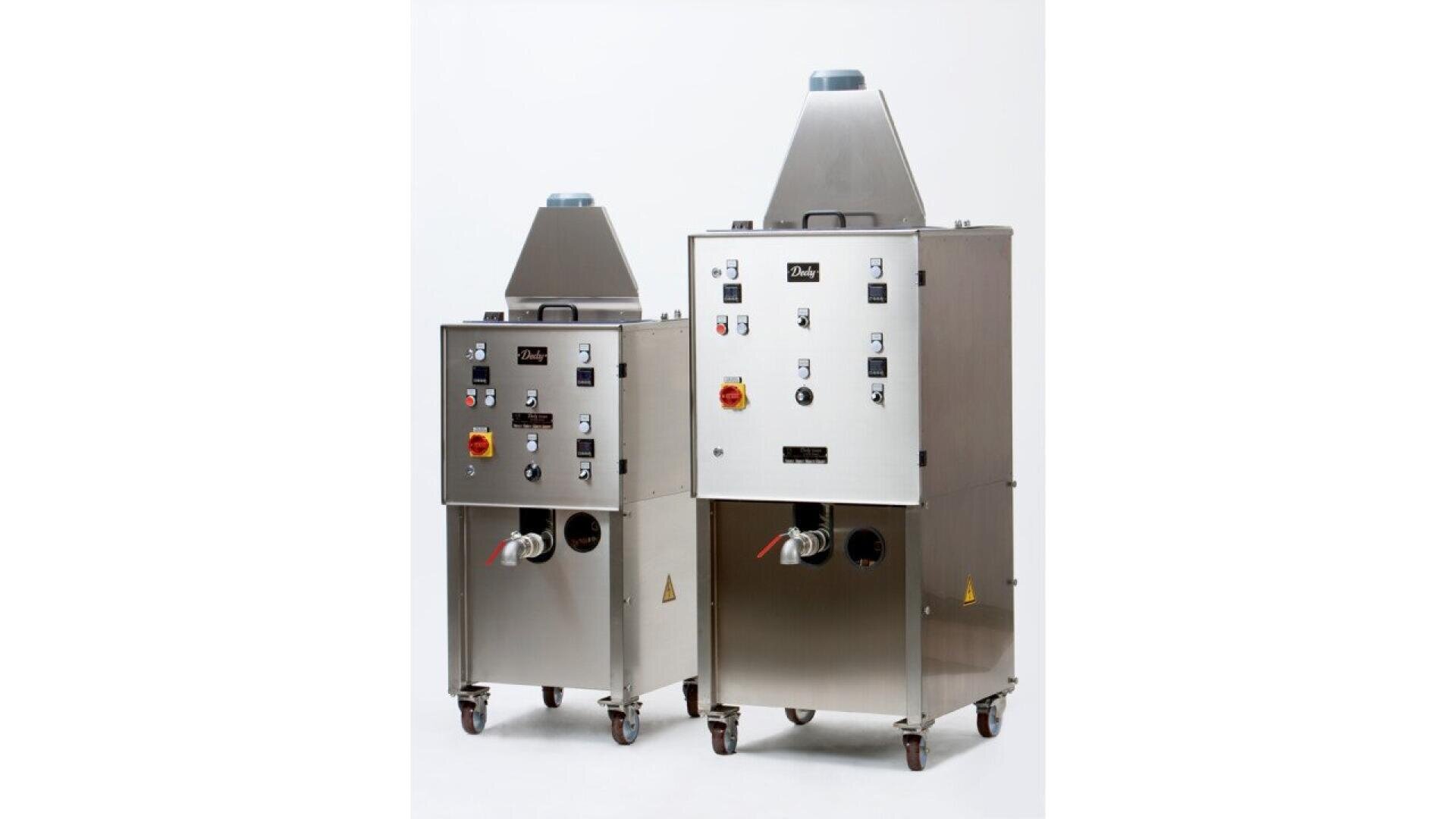 Two large, stainless steel industrial machines with control panels, switches, dials, and indicator lights. Both units have wheels for mobility and cone-shaped vents on top, against a plain white background.