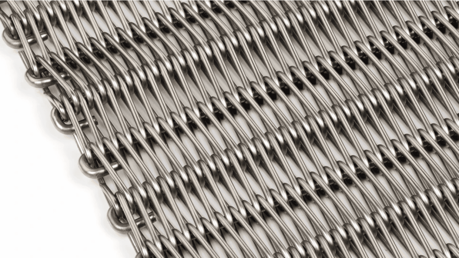 Close-up of a tightly woven metal wire mesh with a repetitive, crisscross pattern, showing shiny, interlocking steel wires arranged in parallel rows.