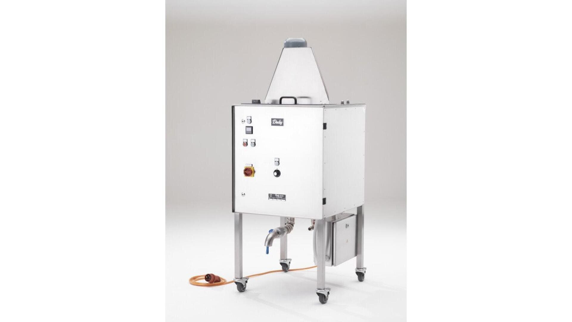 A stainless steel industrial machine on wheels with control buttons, pipes, and an orange power cord, set against a plain white background.