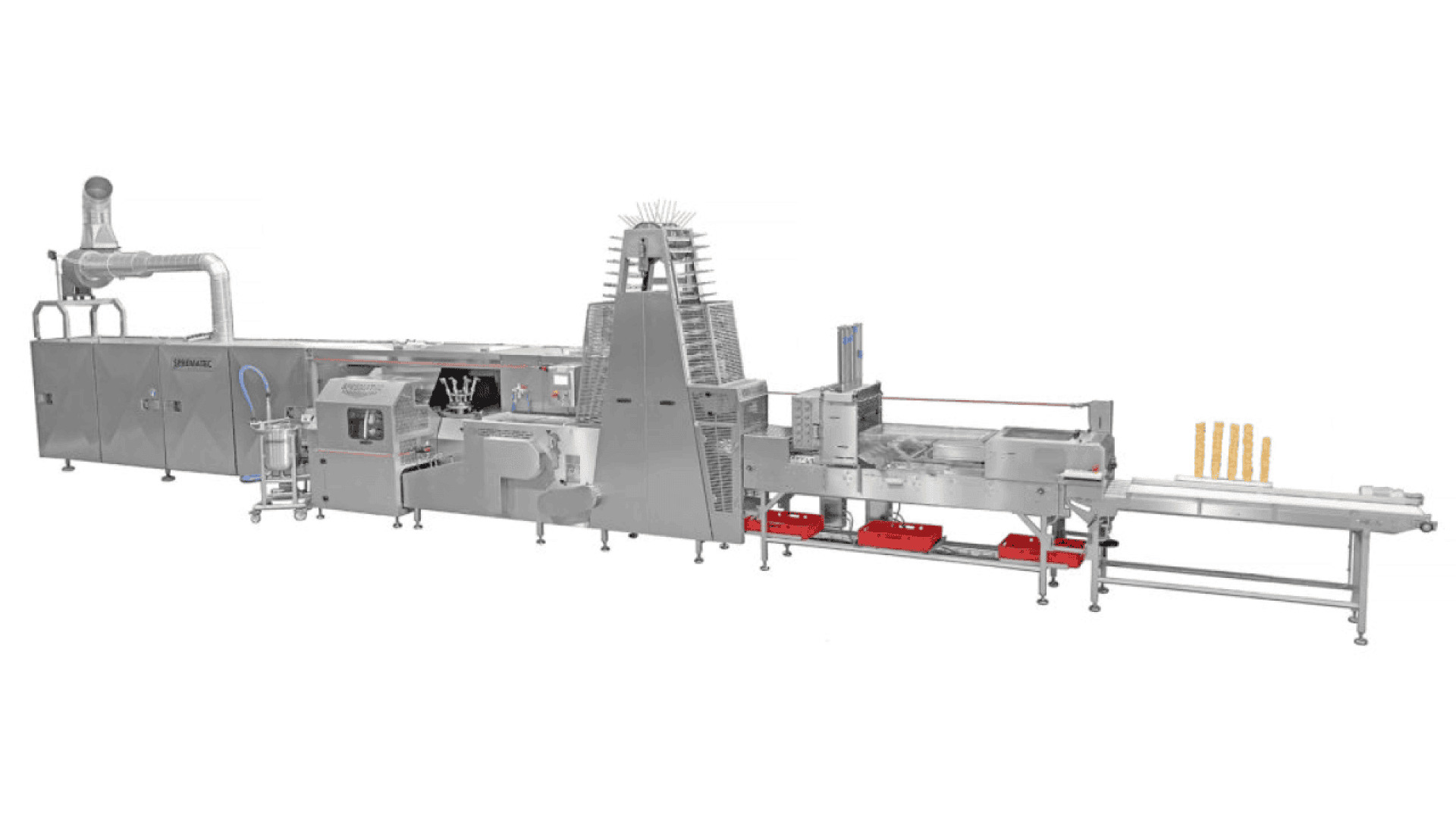 A large industrial food processing and packaging machine made of stainless steel with various components, conveyor belts, and automated sections; several pieces of packaged food are visible at the end.