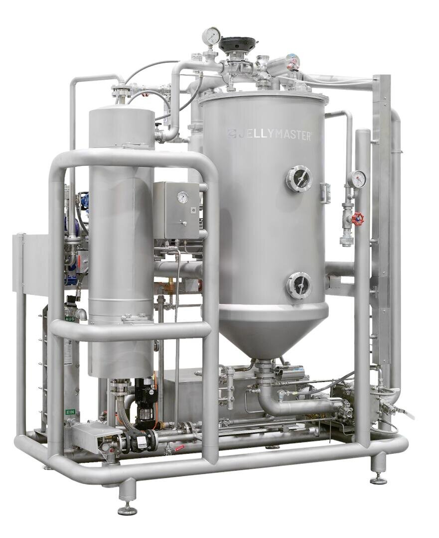 Eine große Industriemaschine mit der Bezeichnung JELLYMASTER aus rostfreiem Stahl mit zylindrischen Behältern, Rohren, Messgeräten und Ventilen, die auf einem Metallrahmen montiert sind und für die Verarbeitung von Lebensmitteln oder Chemikalien verwendet werden.