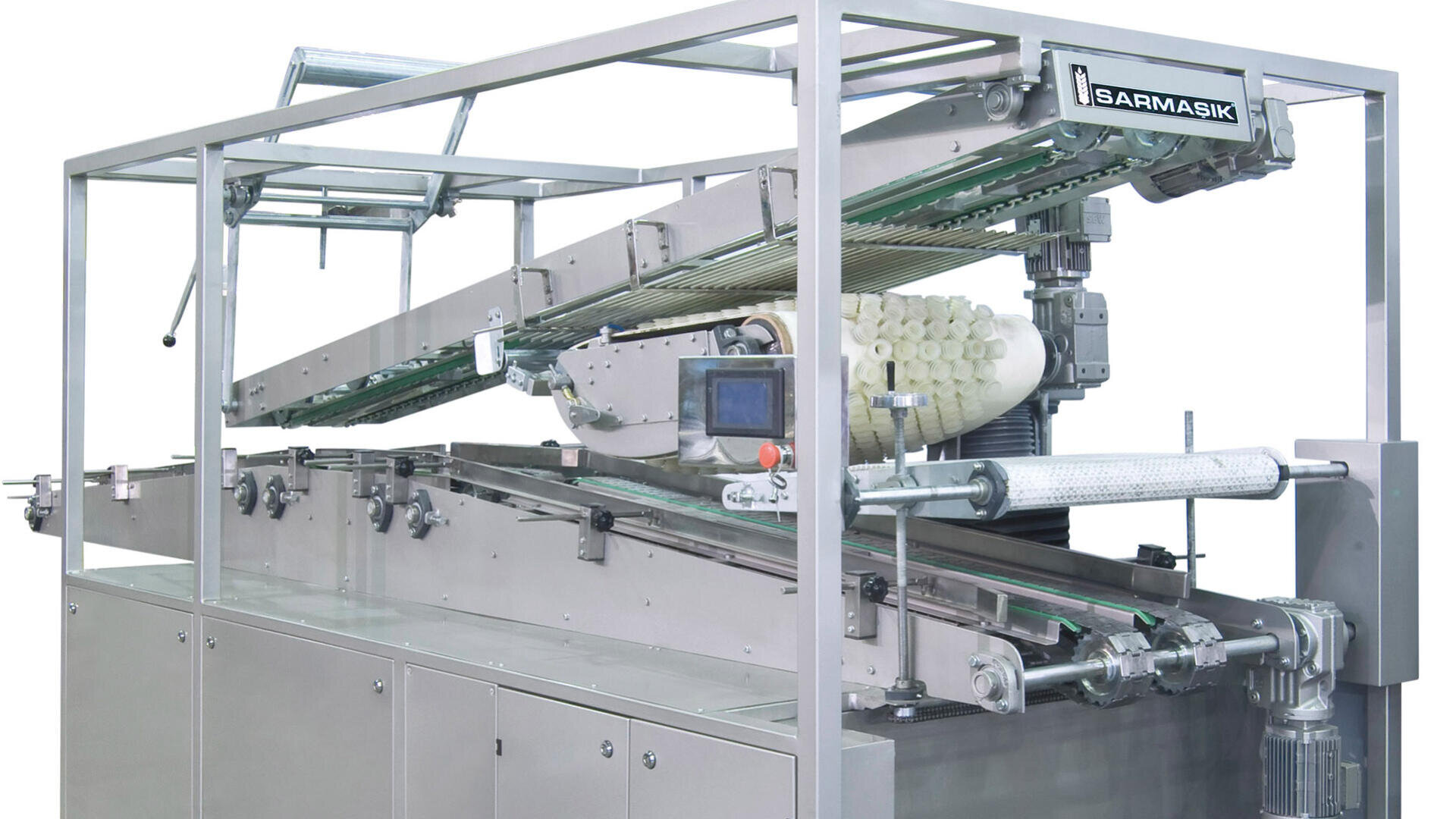 A large industrial bread production machine with conveyor belts, rollers, and a control panel, enclosed in a metal frame. The machine is labeled SARMAŞIK.