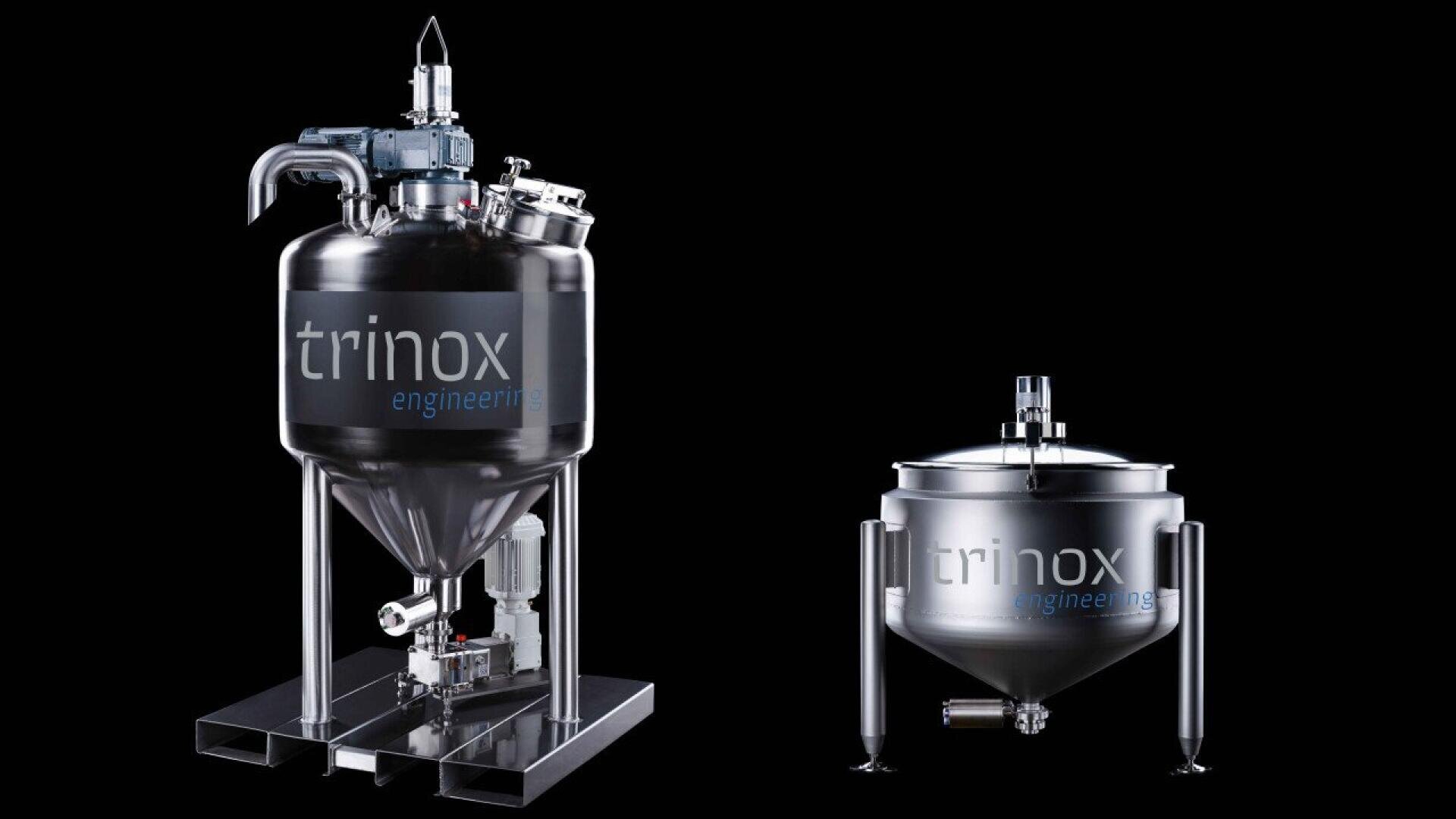 Two stainless steel industrial tanks from Trinox Engineering are displayed on a black background. The left tank is larger with a top motor and various attachments; the right tank is smaller and more compact.