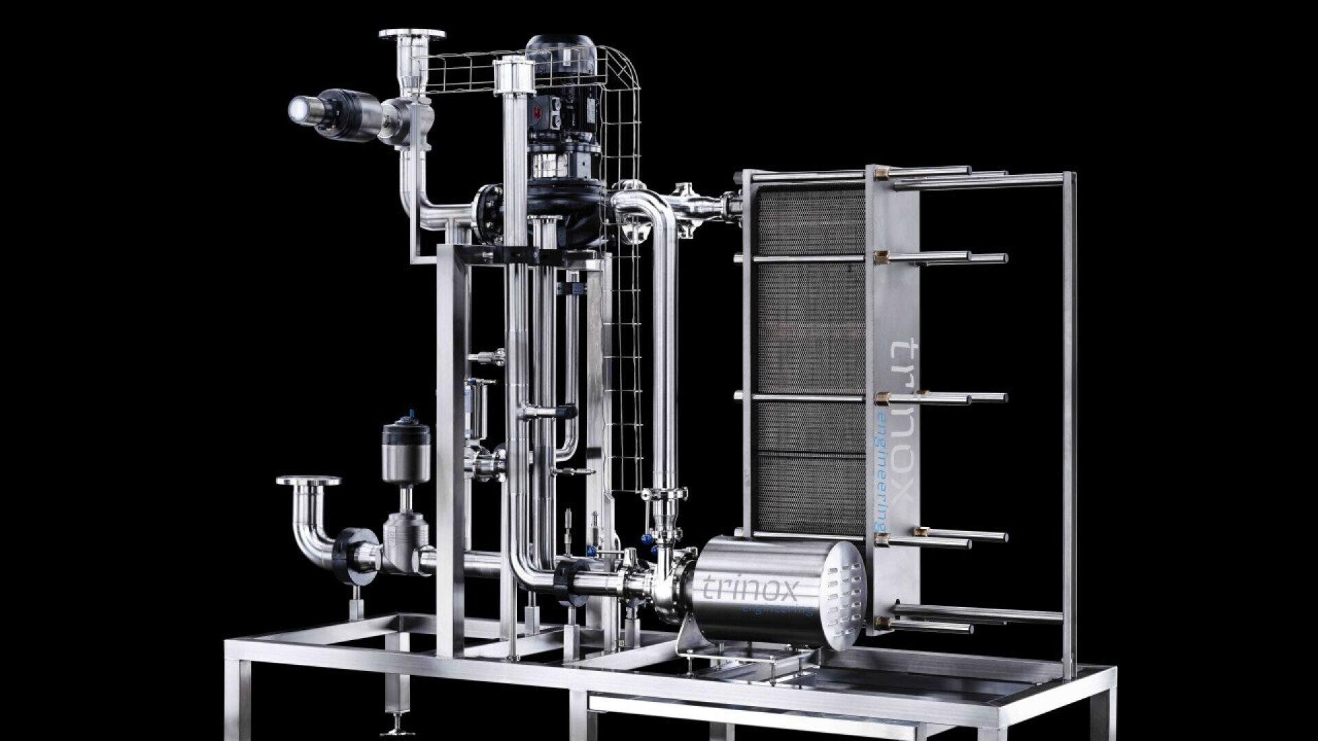 A stainless steel industrial filtration system with pipes, valves, and a control motor mounted on a frame, set against a black background.