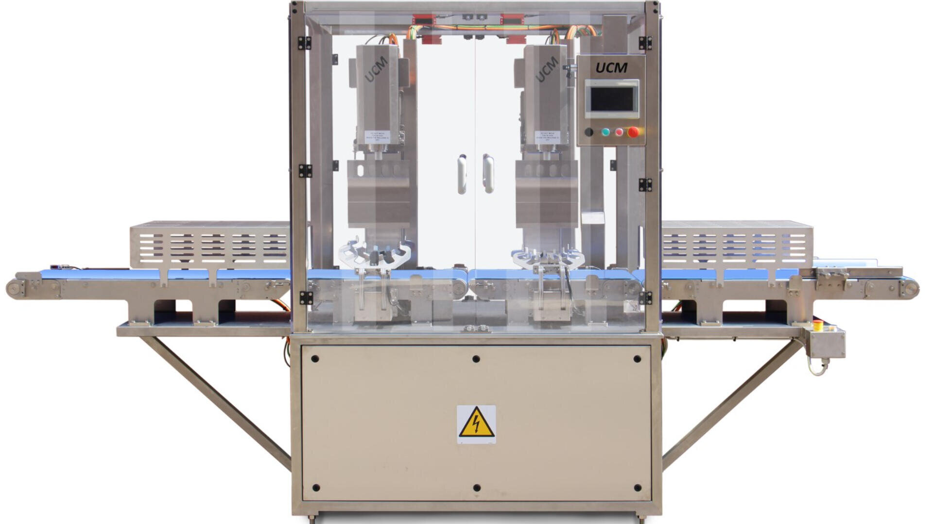 Front view of a modern industrial machine with a transparent enclosure, control panel on the right, and conveyor belts on both sides, used for automated manufacturing or assembly processes.