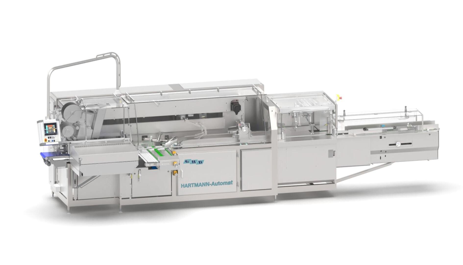 Eine große, industrielle Brotverpackungsmaschine mit einem Förderband, einem Bedienpult und verschiedenen Fächern mit der Bezeichnung HARTMANN-Automat, die für die automatische Brotverarbeitung und -verpackung konzipiert ist.