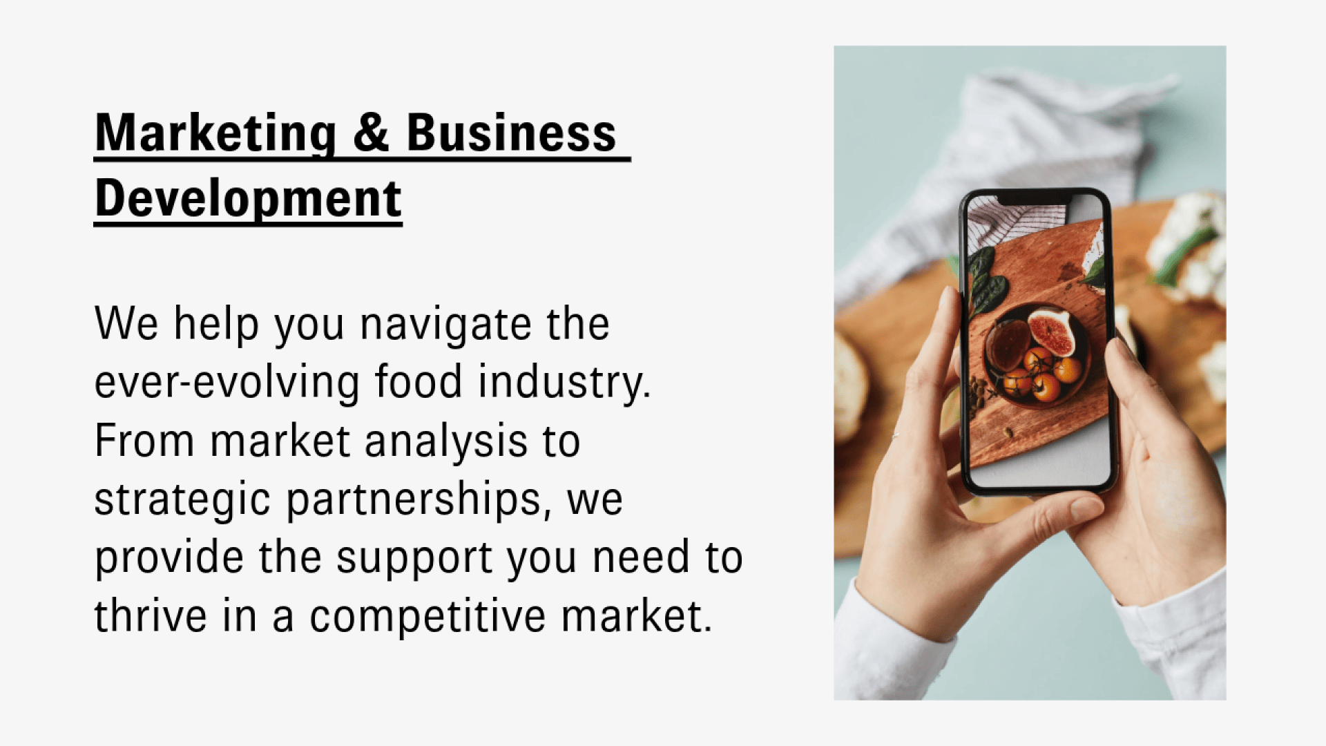 A person holds a smartphone, taking a photo of a wooden board with figs and basil. Beside the image, text highlights marketing and business development support for the food industry.