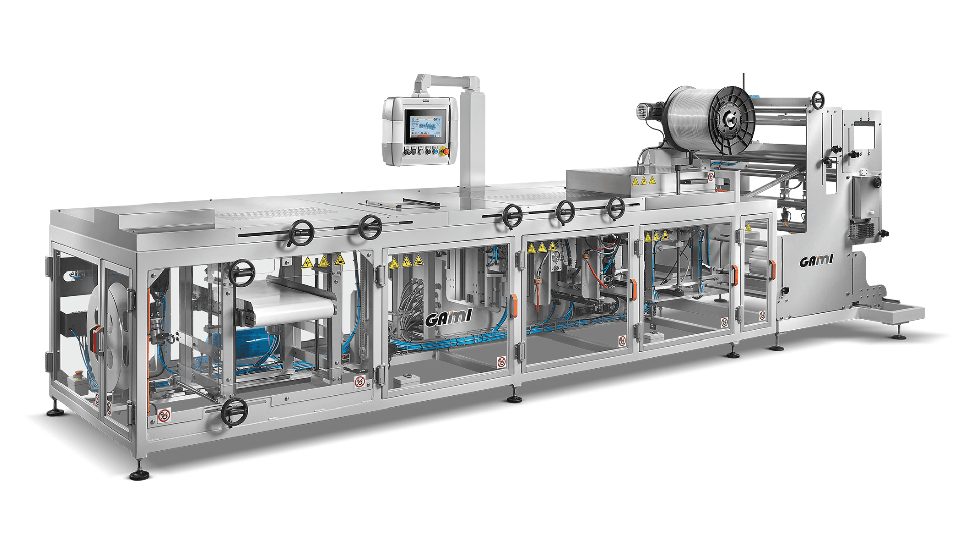 A large industrial packaging machine with a control panel, rollers for plastic film, and transparent panels revealing internal components and conveyor systems. The machine is labeled “Gami” and appears made of stainless steel.