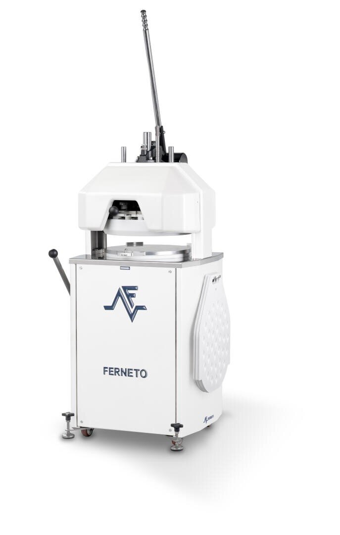 A white, industrial dough divider machine labeled FERNETO with levers, a handle, and a logo on the front, standing on metal legs against a white background.