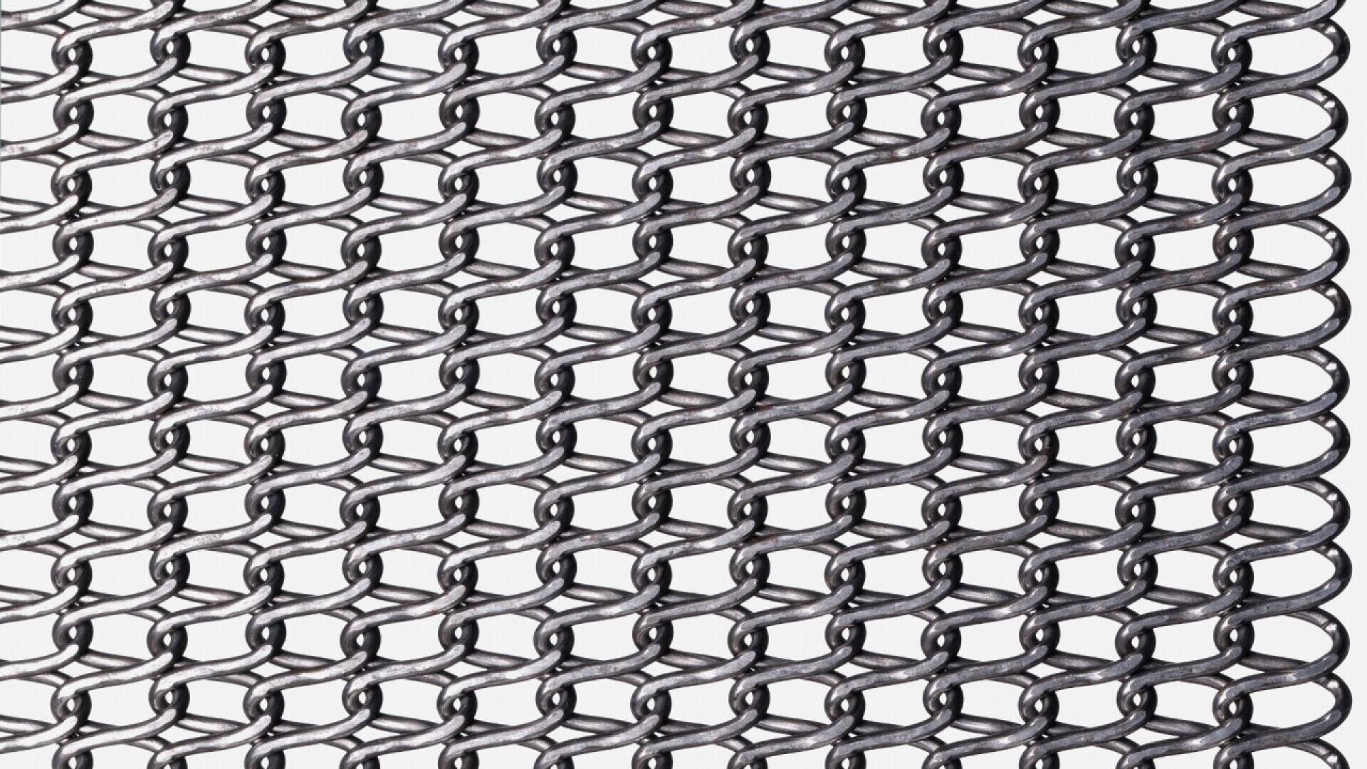 Close-up view of interlocking metal rings forming a chainmail pattern against a white background. The links create a repeating, overlapping design typical of medieval armor or protective mesh.