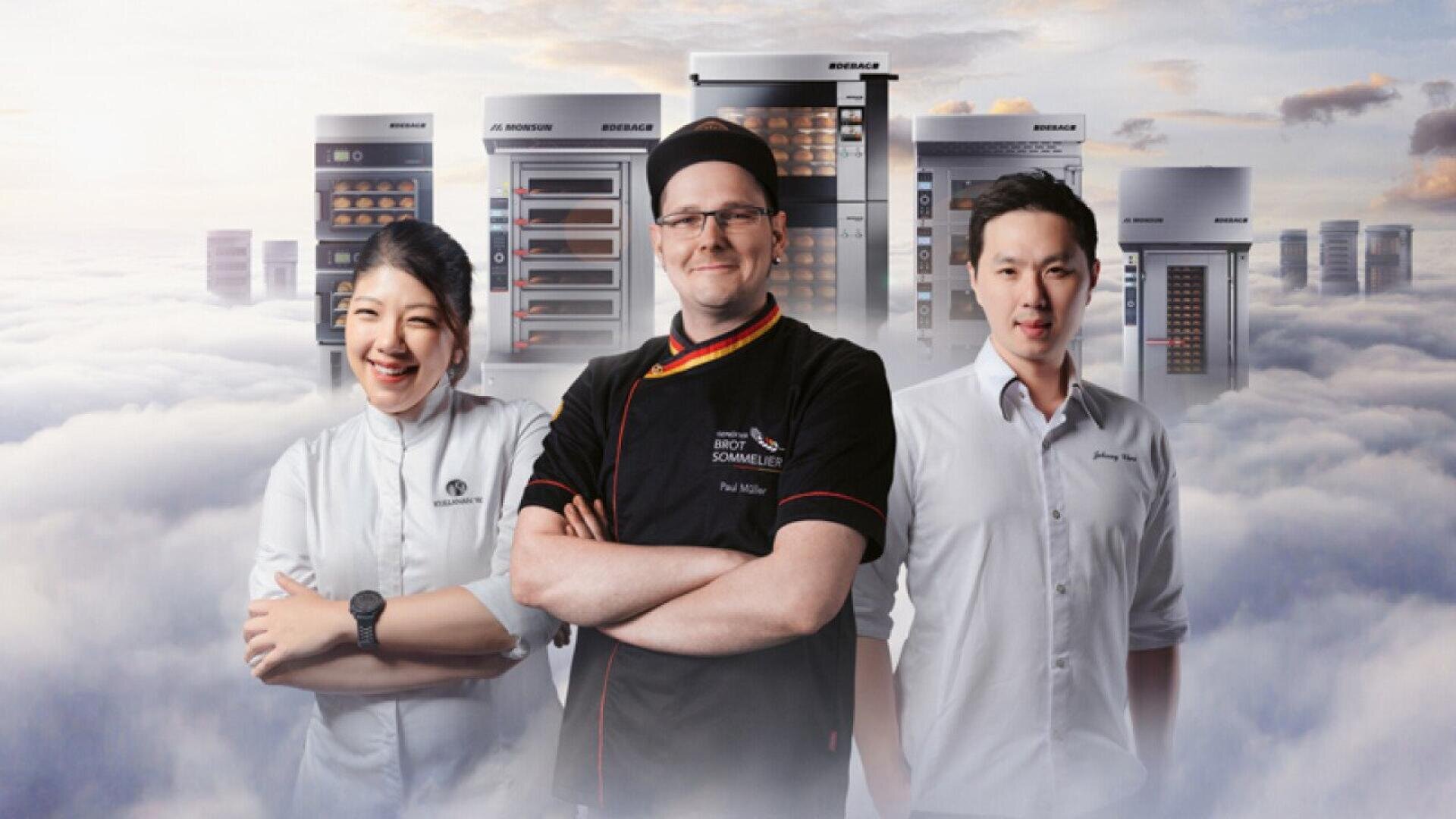 Three chefs stand confidently in front of commercial ovens, smiling, with a cloudy sky background that creates a dramatic, elevated effect.