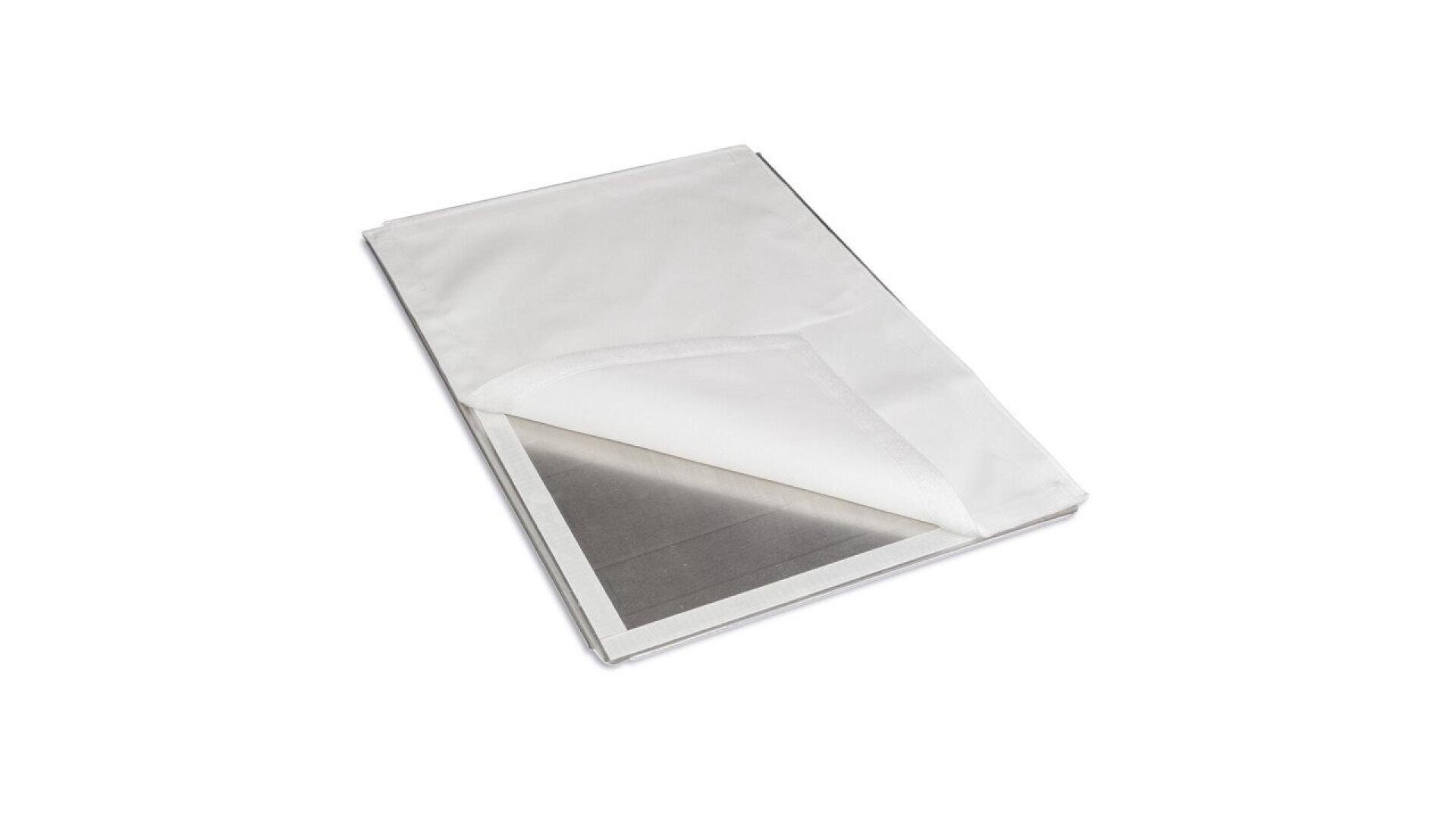 A white, rectangular envelope-like pouch is partially open, revealing a shiny metallic inner layer. The image is set against a plain white background.