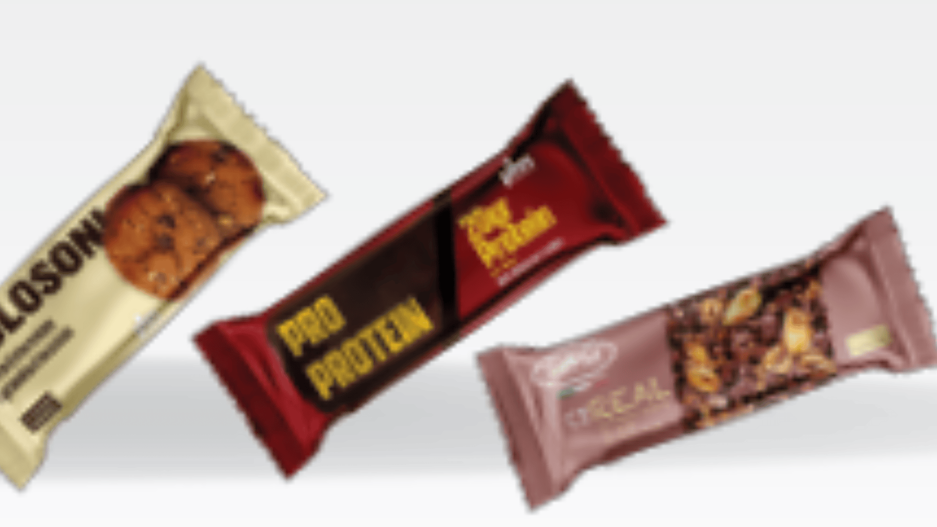 Three different protein or snack bars in colorful wrappers—one beige with cookies, one dark red labeled Pro Protein, and one pinkish with cereal and chocolate pieces—are displayed against a light background.