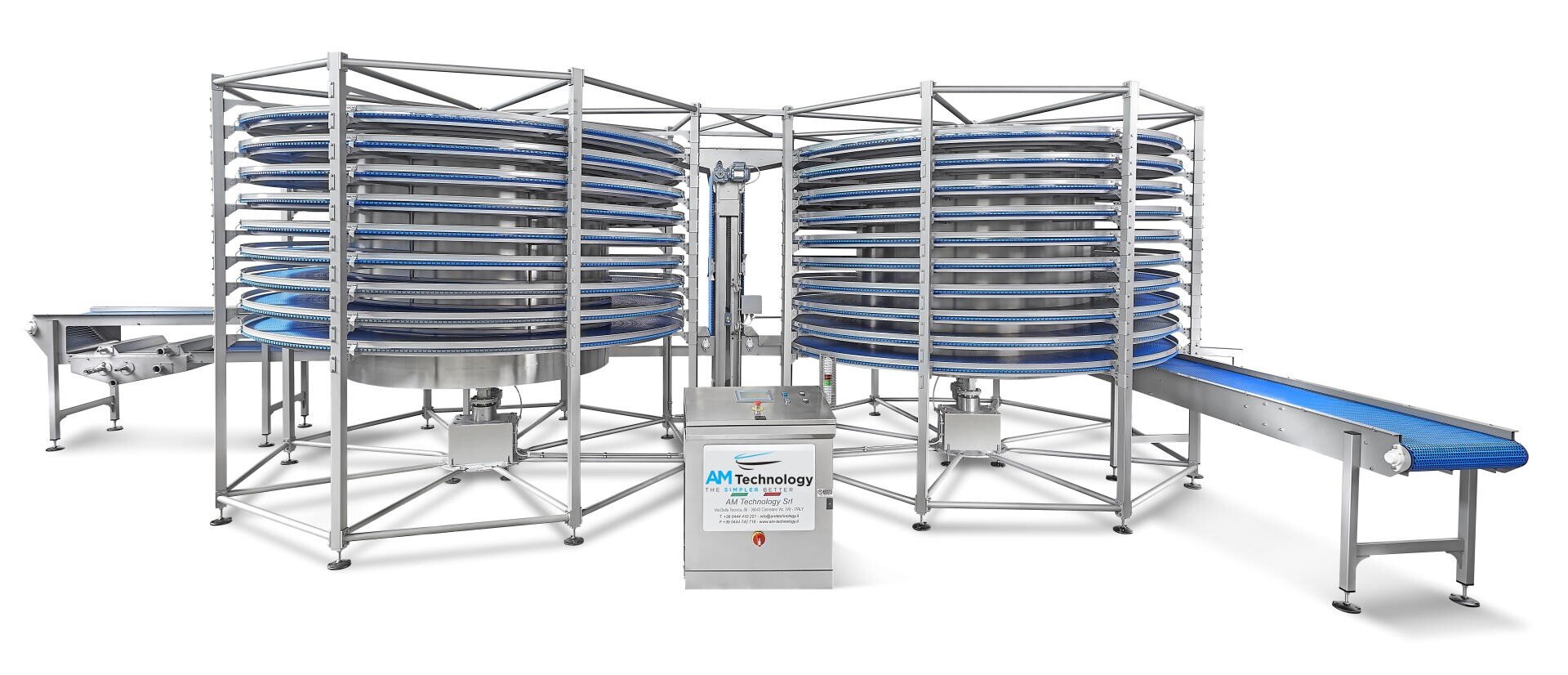 A large industrial spiral conveyor system with blue belts and metal framework, designed for transporting items vertically in food processing or manufacturing facilities. The system features two spiral towers and connected conveyor belts.