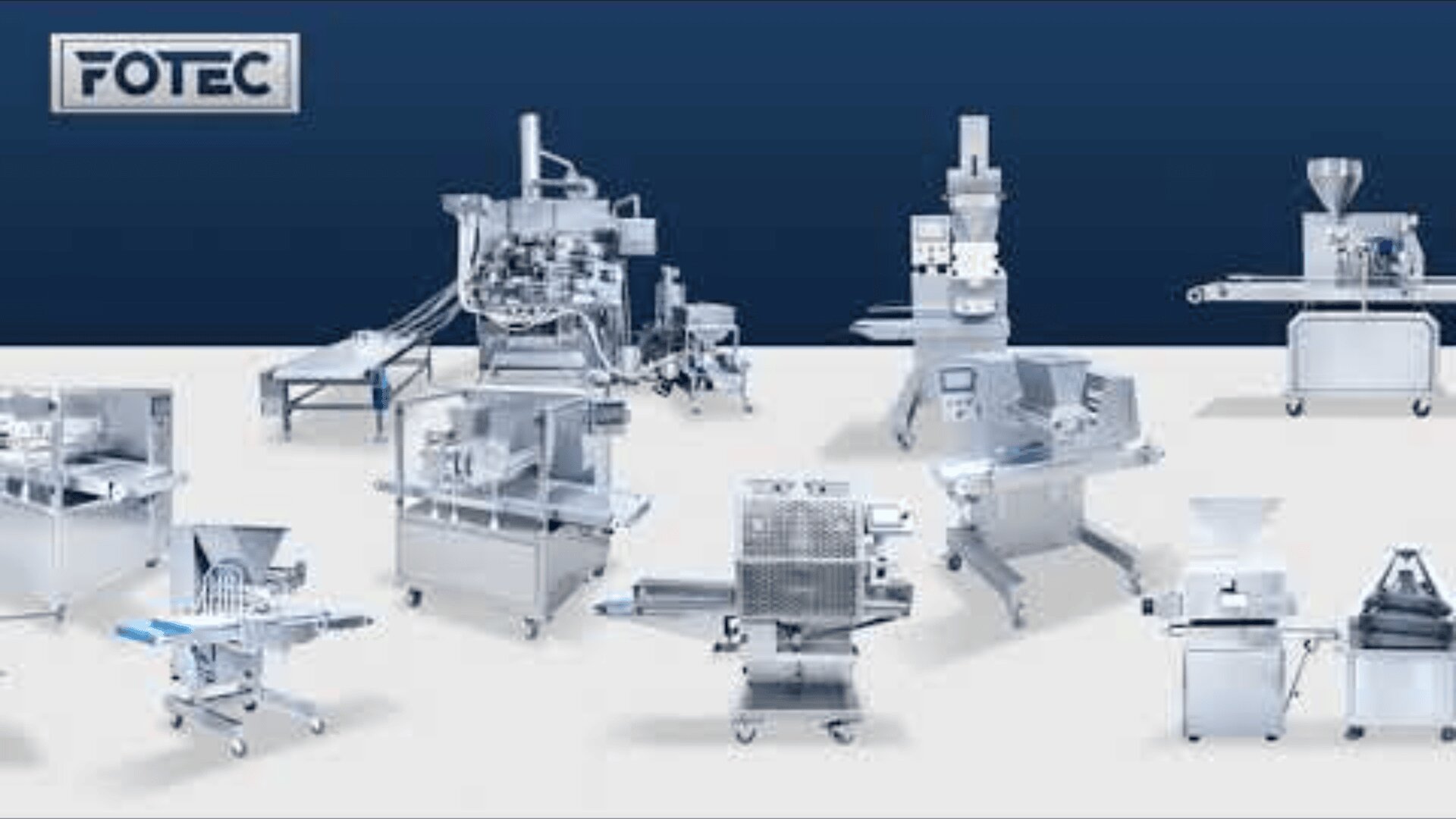 A variety of industrial food processing machines are arranged on a light gray floor with a dark blue backdrop; the FOTEC logo appears in the top left corner.
