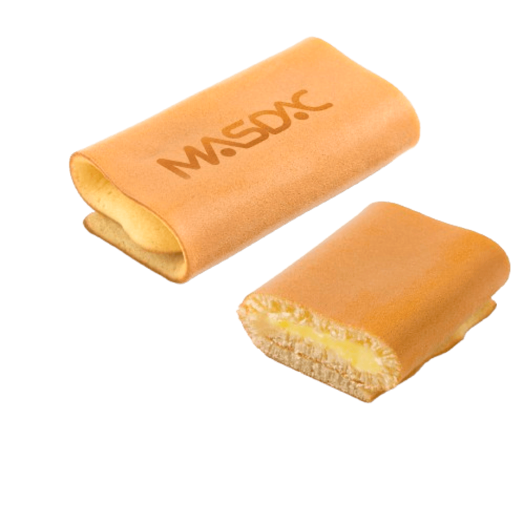 Two rectangular sponge cakes, one whole with MSDX written on top, and one cut in half showing a creamy yellow filling inside. The background is transparent.