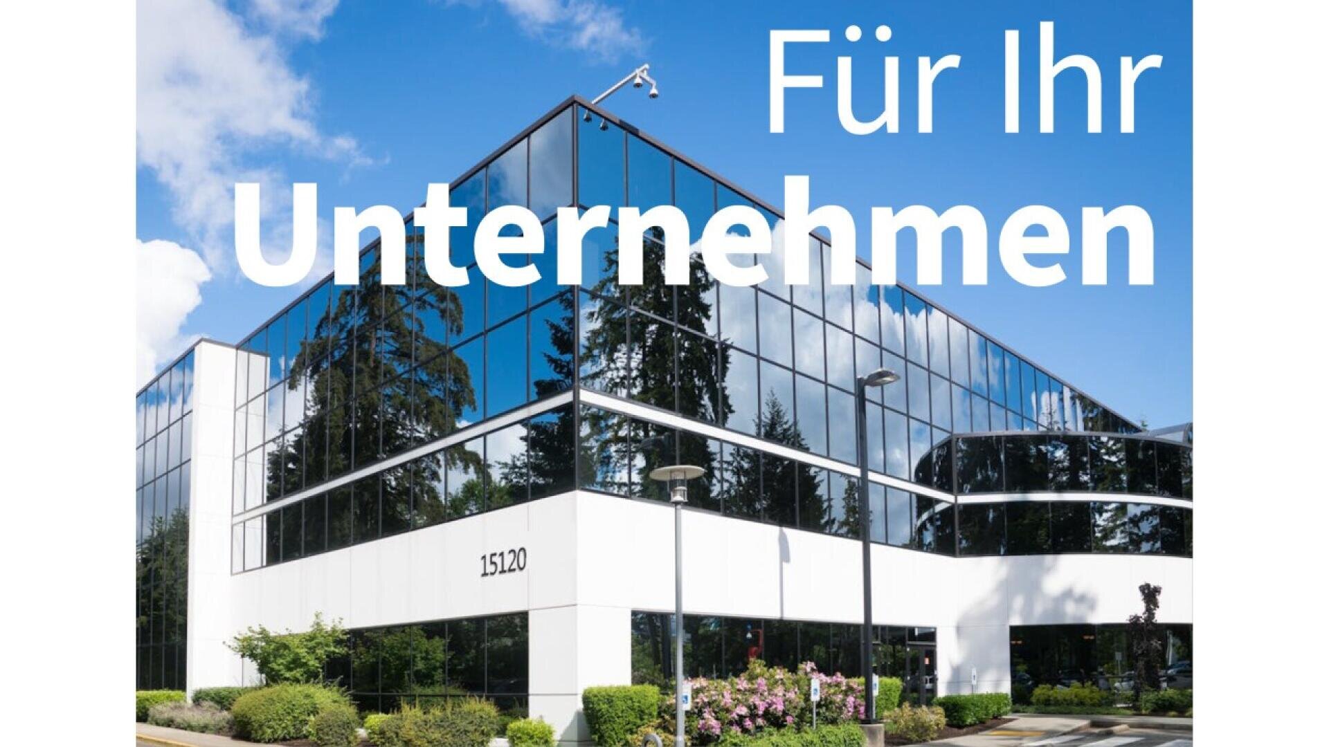 A modern glass office building with trees reflected in the windows and Für Ihr Unternehmen in large white text across the top right. The building number 15120 is visible near the entrance.