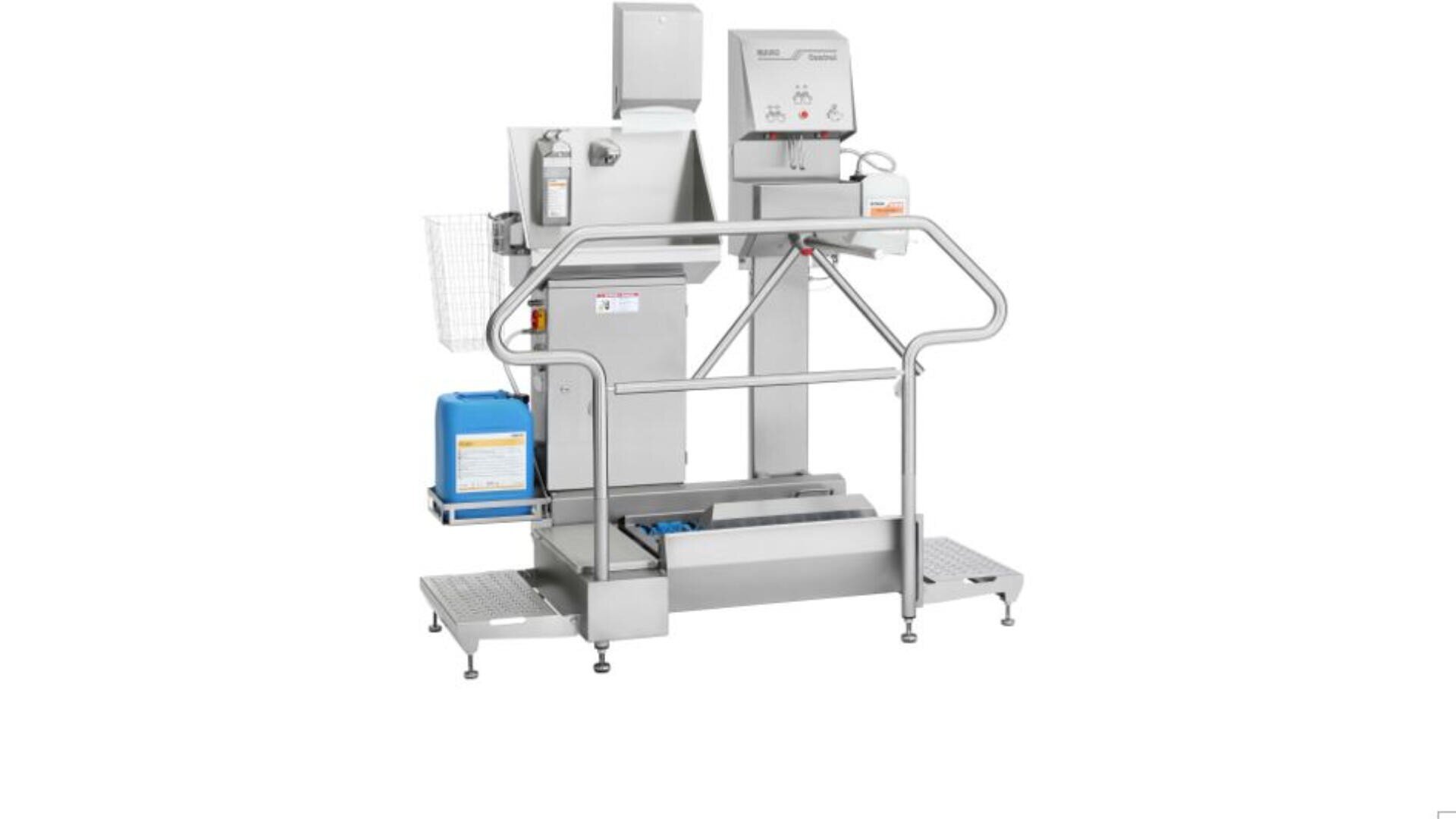 A stainless steel industrial hygiene station with a turnstile, hand sanitizer dispenser, railings, control panel, and foot cleaning brushes, designed for use in food or pharmaceutical production areas.