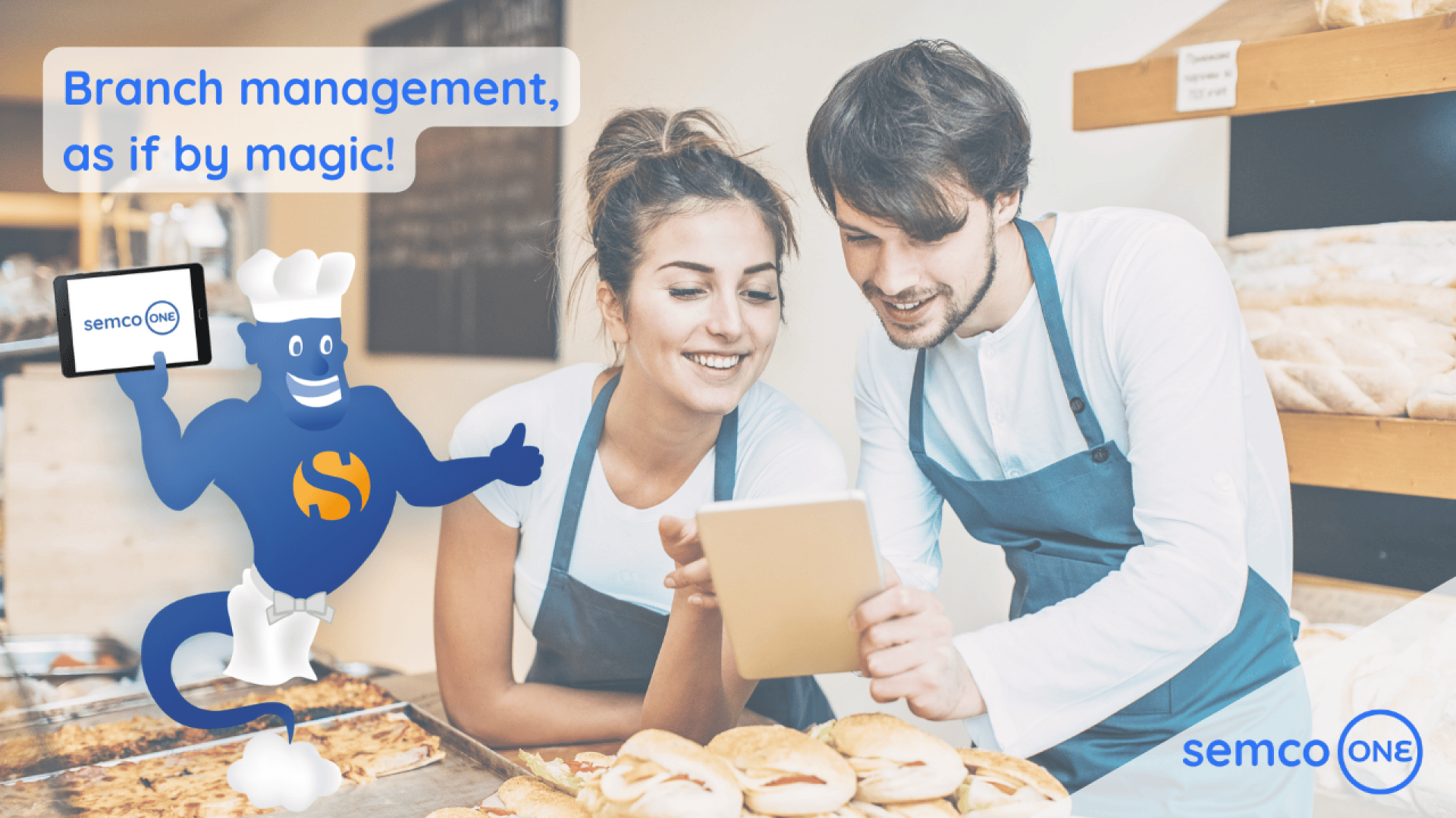 A smiling man and woman in a bakery looking at a tablet. Next to them is a blue genie holding a tablet that says semco ONE. Text reads, Branch management, as if by magic! Semco ONE logo is in the corner.