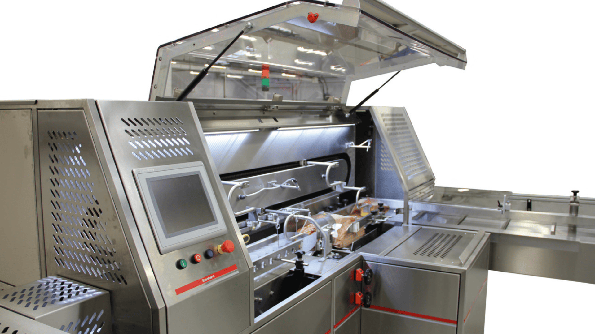 Automated packaging machine with open lid, digital control panel, and mechanical arms inside, designed for processing or sealing products on a stainless steel assembly line.