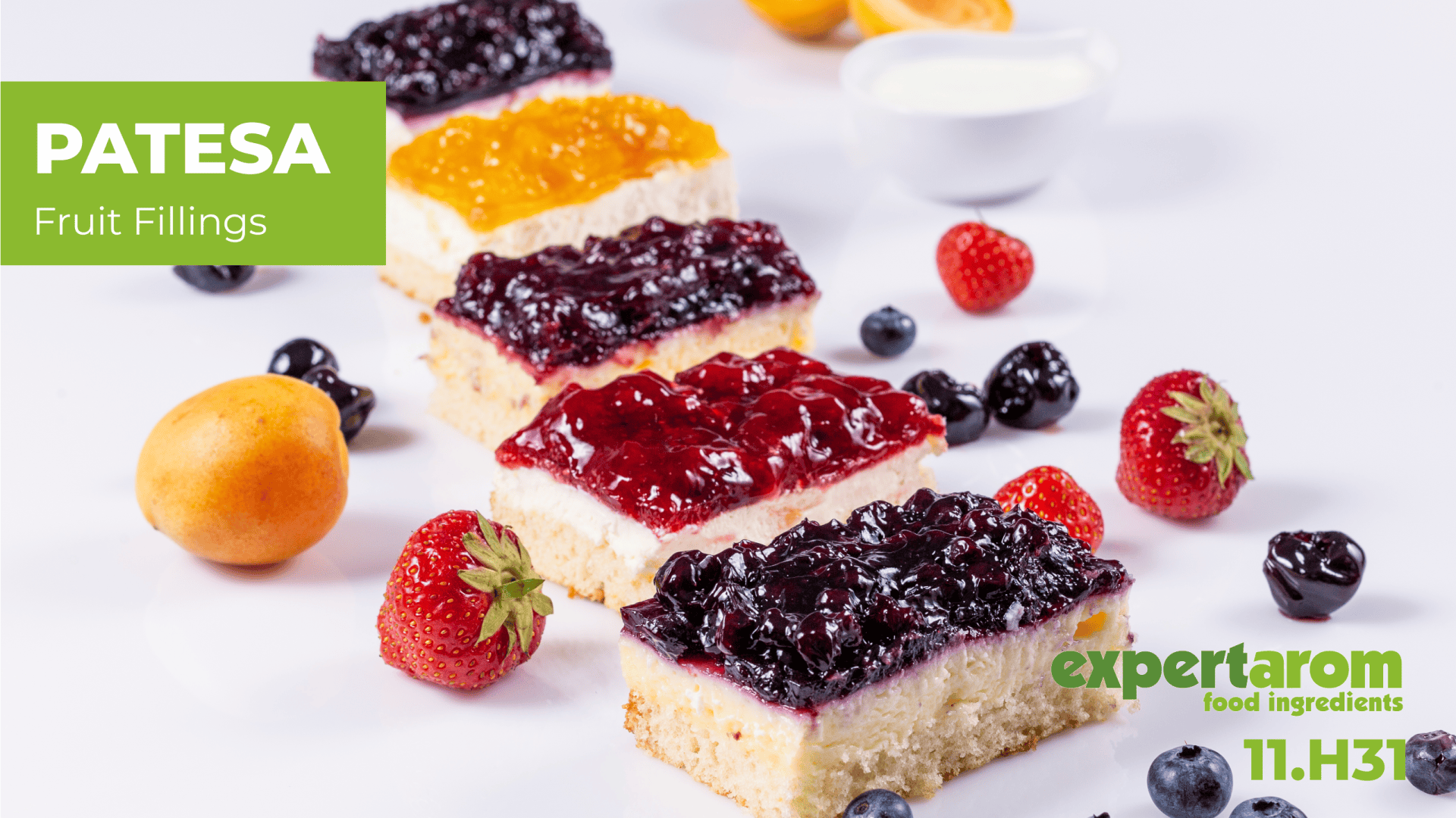 Four cheesecake bars topped with colorful fruit fillings, surrounded by fresh strawberries, apricots, and blueberries. Text reads: “PATESA Fruit Fillings” and “expertaom food ingredients 11.H31”.
