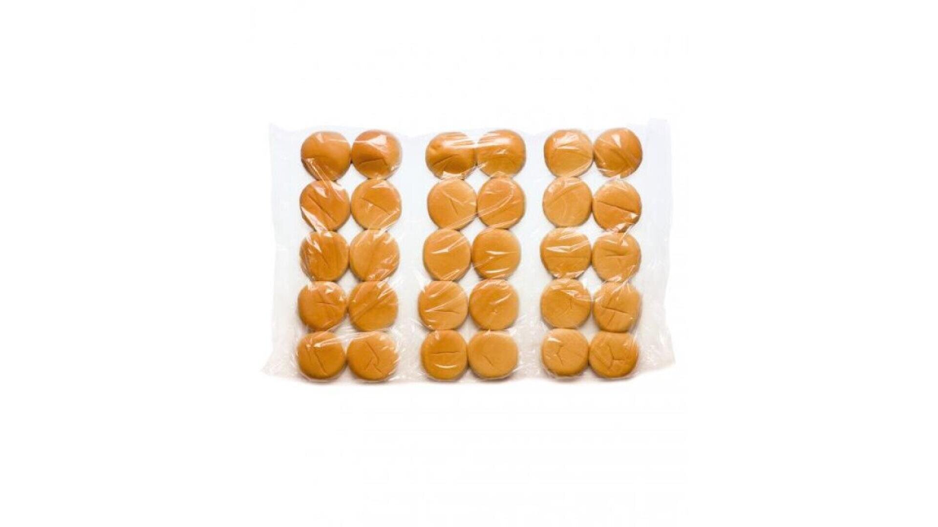 A clear plastic bag containing 24 plain hamburger buns arranged in four rows of six, viewed from above against a white background.