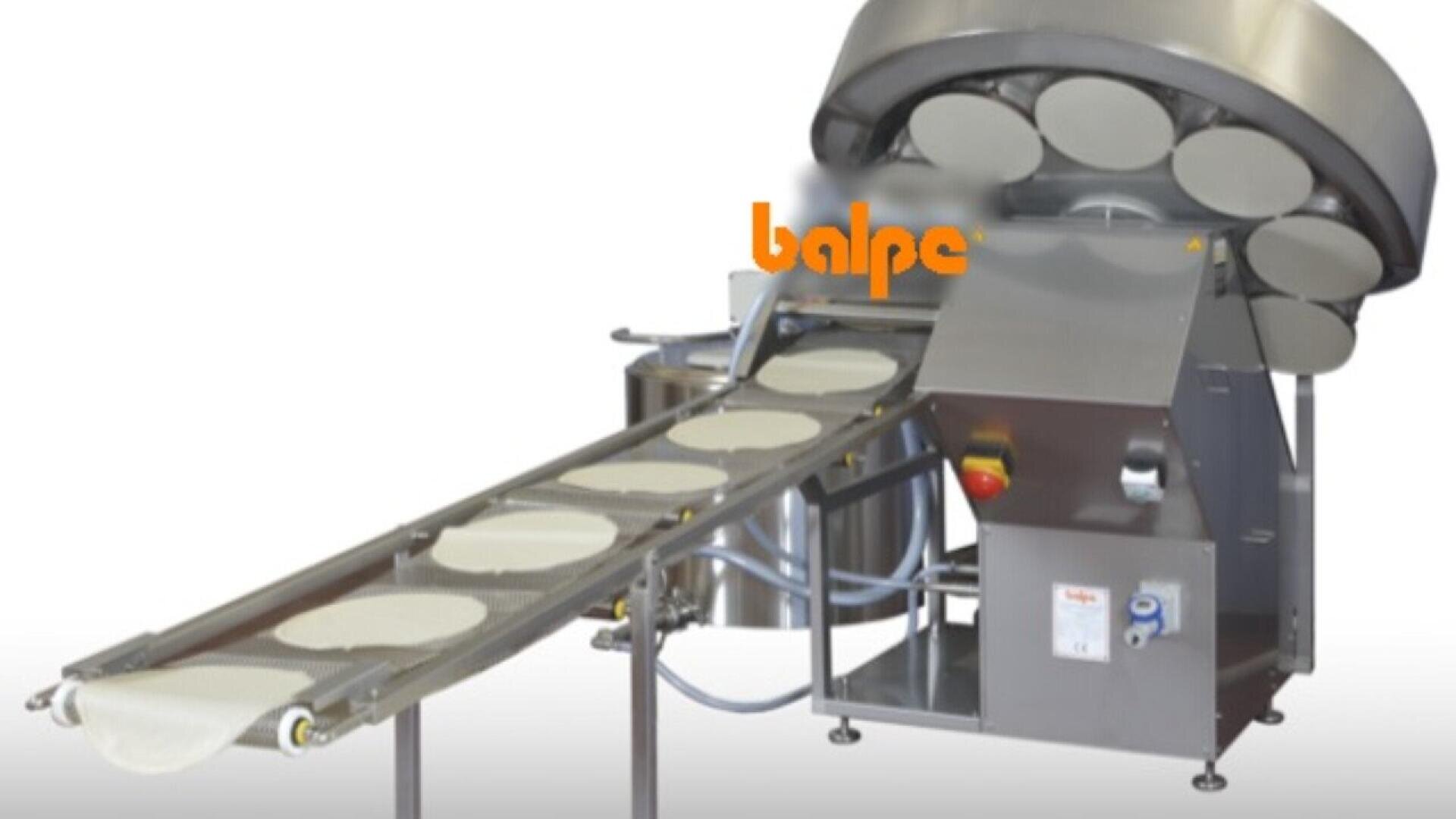A stainless steel industrial machine with conveyor belt holds multiple round flat dough pieces. The brand name balpe is visible in orange on the machines upper section.
