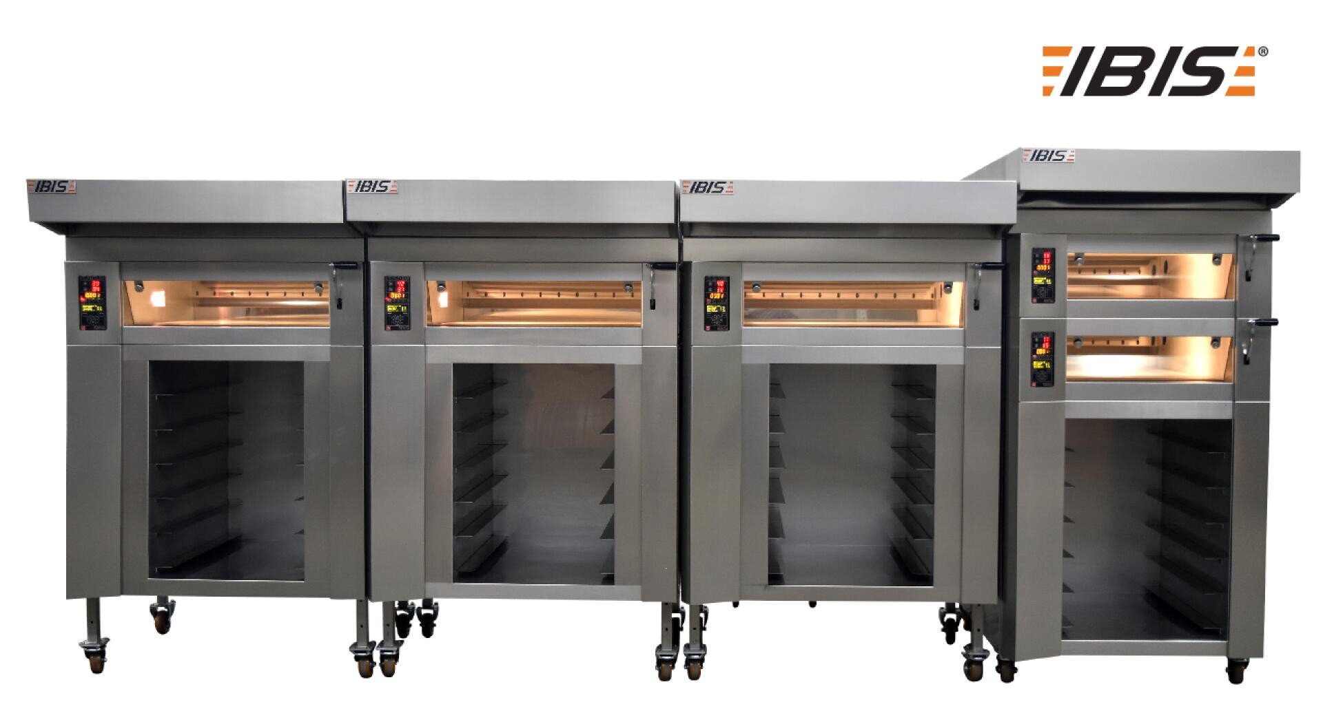 A row of four large industrial stainless steel bakery ovens on wheels with digital controls, glass windows, and the IBIS logo in the top right corner.