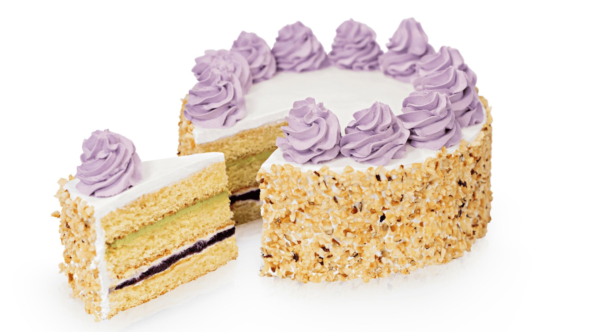A round layer cake with white frosting, decorated with swirls of purple icing on top and chopped nuts around the sides. One slice is cut and slightly separated from the cake, showing two inner layers with cream and jelly filling.