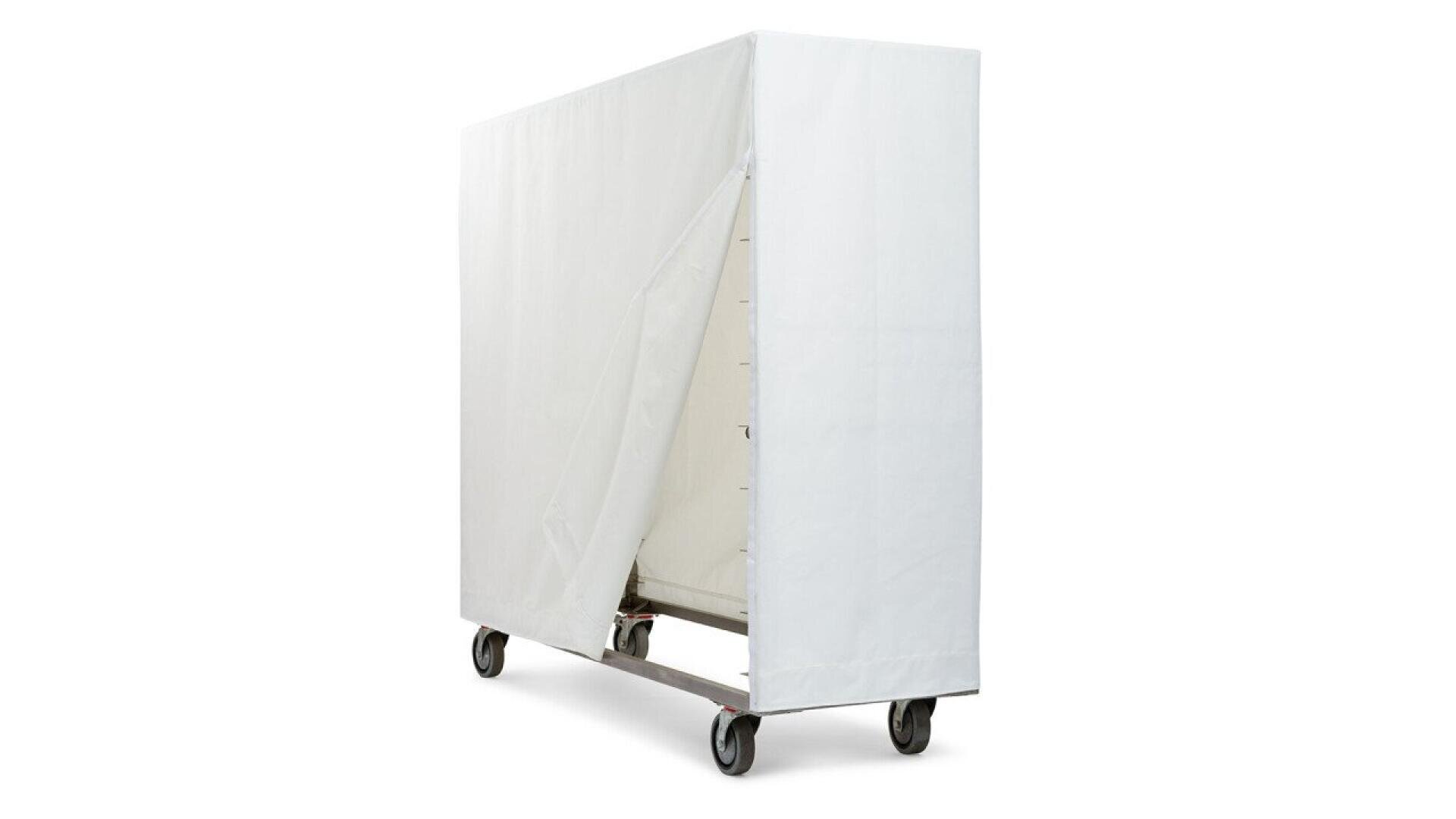 A large metal rack on wheels is covered by a white fabric cover with a partially open front, revealing shelving inside.