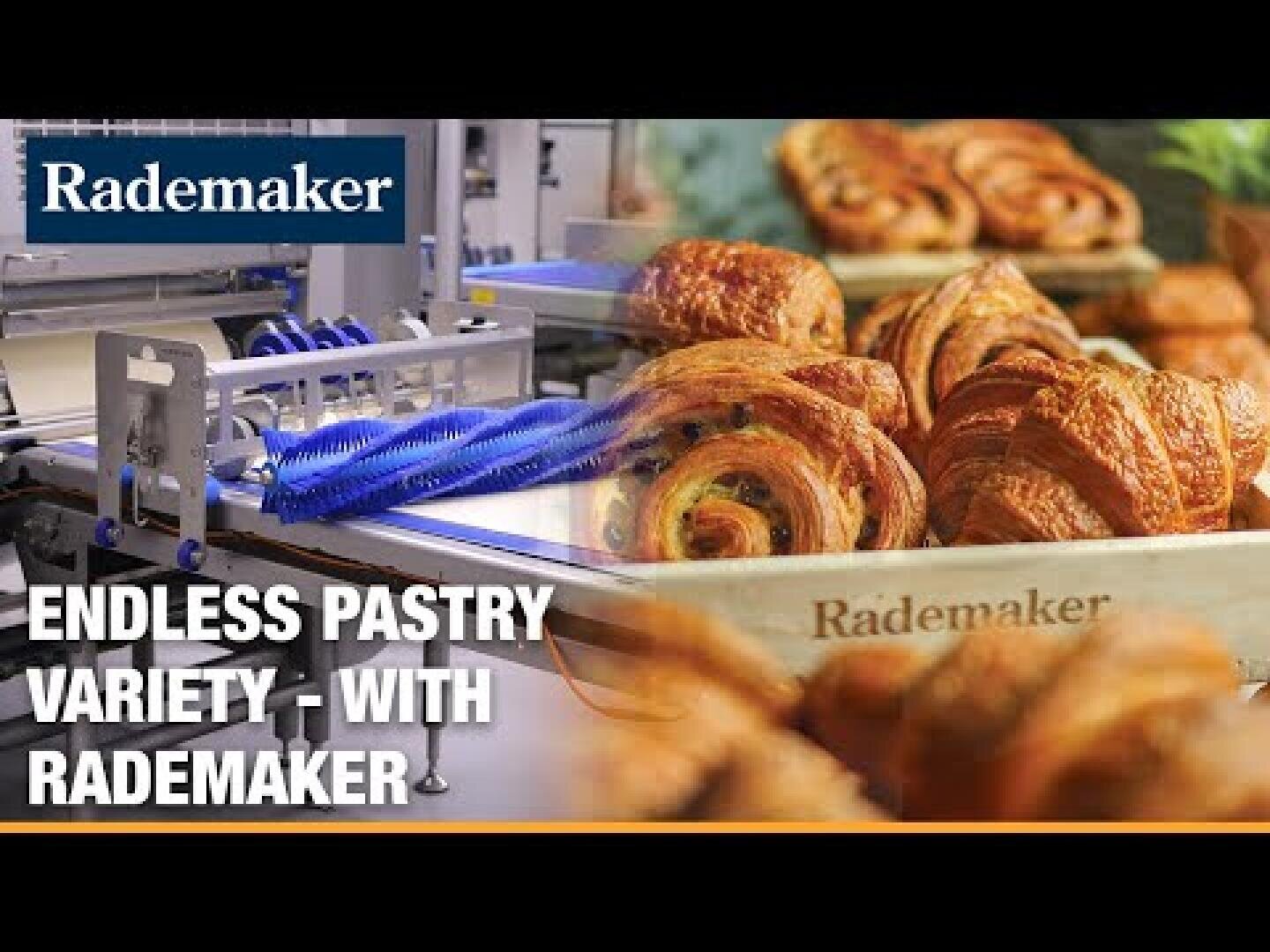 A close-up of assorted croissants and pastries on a tray with a Rademaker logo, next to automated bakery equipment. Text reads: ENDLESS PASTRY VARIETY - WITH RADEMAKER.