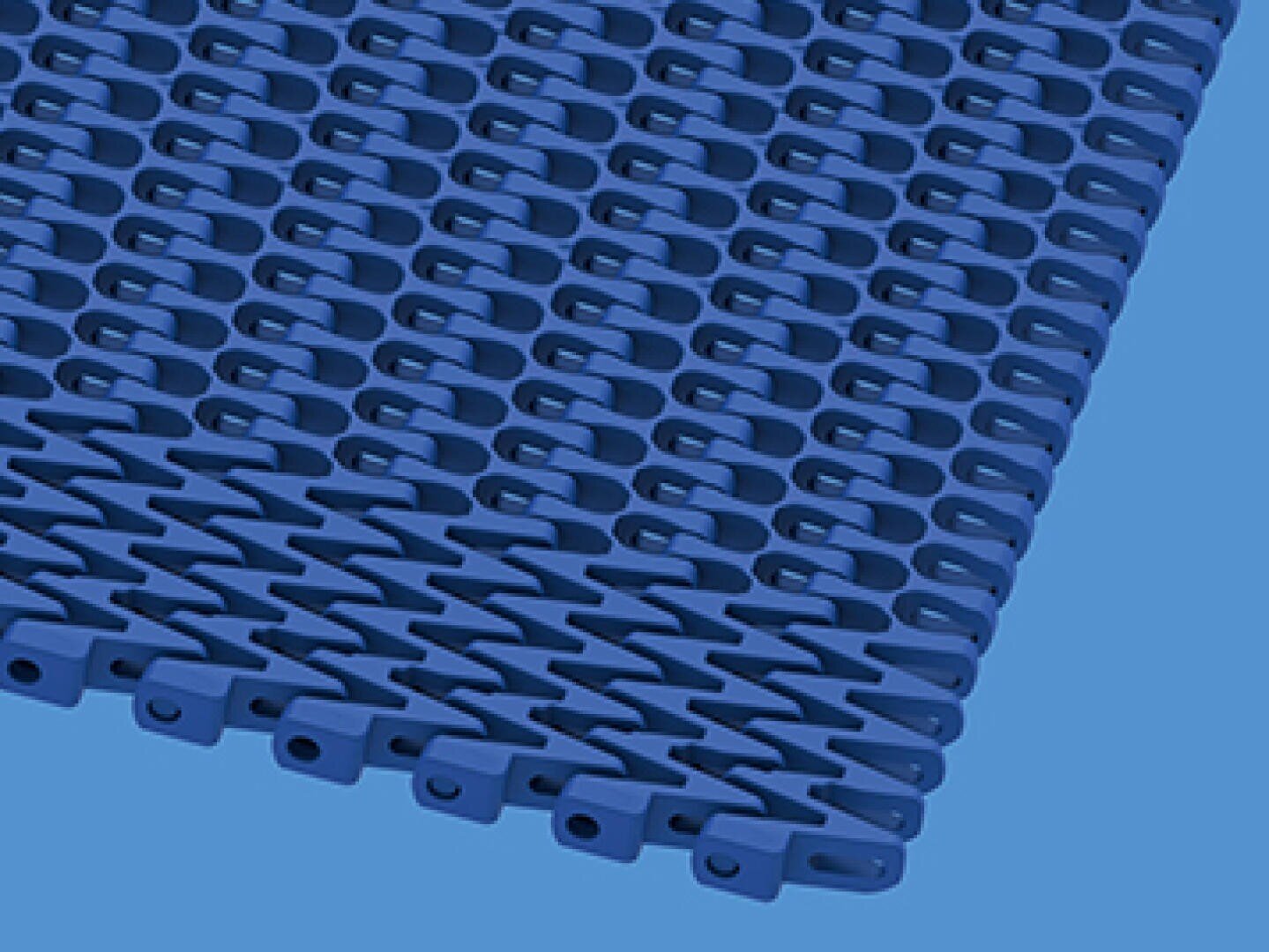 A close-up of a blue, interlocking plastic conveyor belt with repeating rectangular slots and tabs, shown against a light blue background.