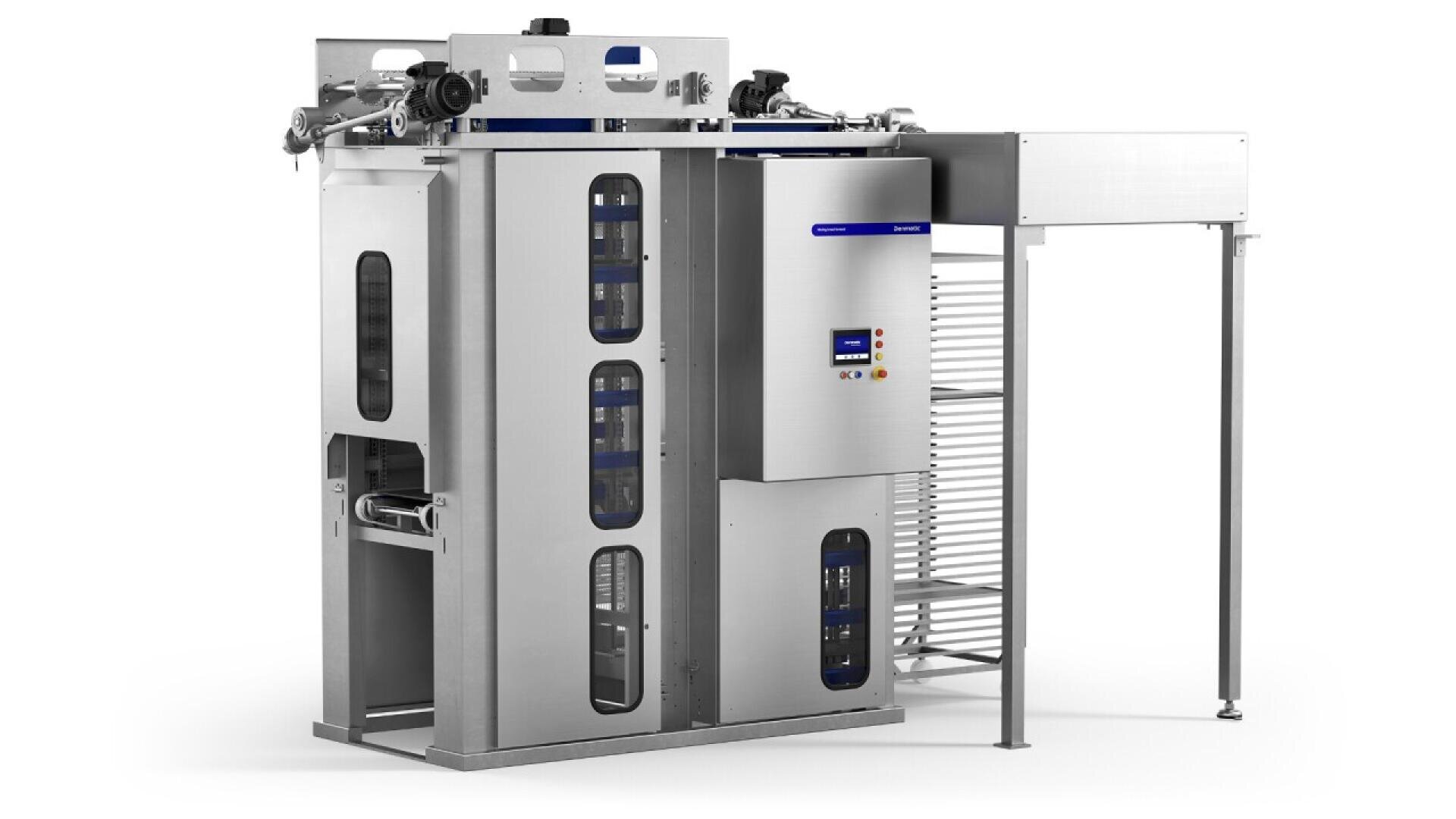 A large industrial stainless steel machine with control panels, vertical windows, and conveyor belts, designed for automated food processing or packaging, standing on a white background.
