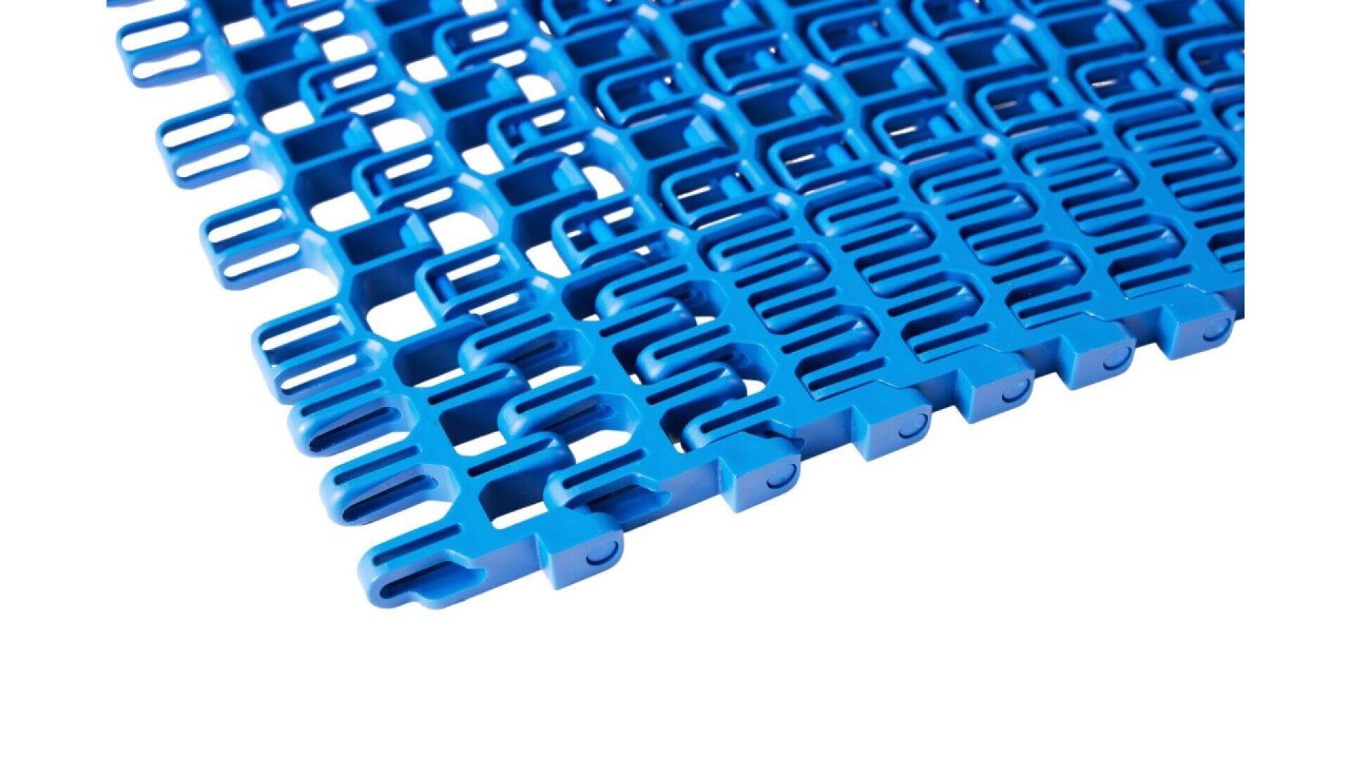 Close-up of a blue plastic interlocking floor mat with a grid-like, open lattice pattern. The mat sections are joined together, and the surface is shown from an angle on a white background.