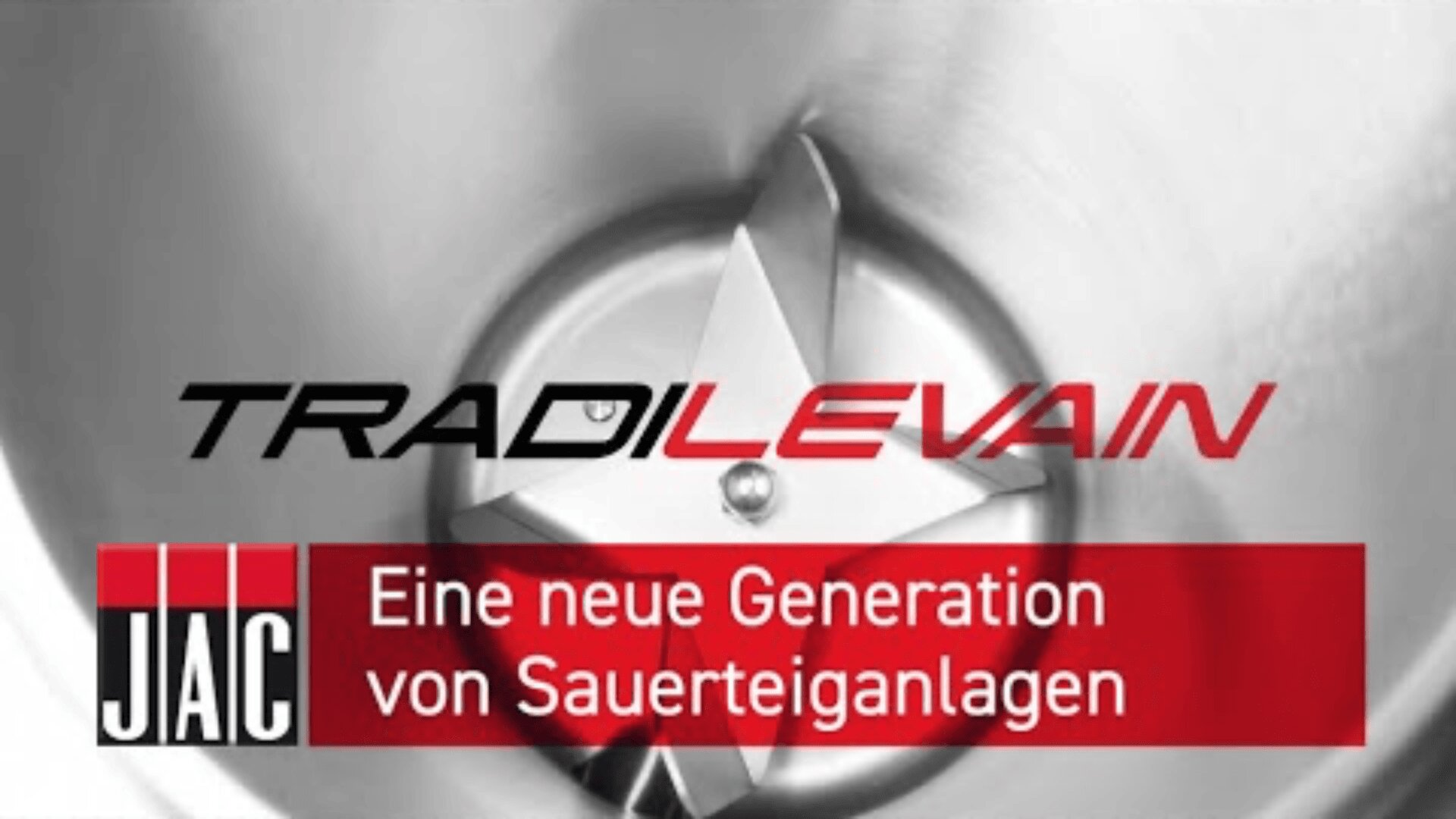Nahaufnahme einer industriellen Mischerklinge mit dem Text TRADILEVAIN und Eine neue Generation von Sauerteiganlagen auf einem roten Banner, das für eine neue Generation von Sauerteiganlagen wirbt.