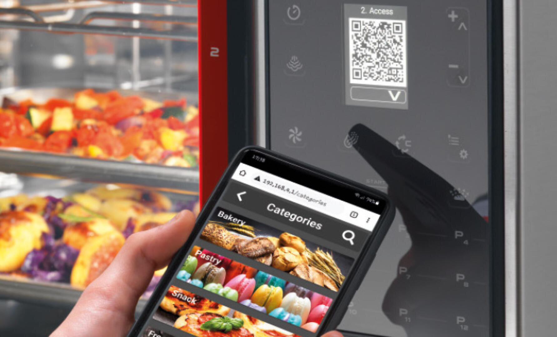A hand holds a smartphone showing a food menu in front of a digital oven display with a visible QR code; trays of cooked food are inside the oven.