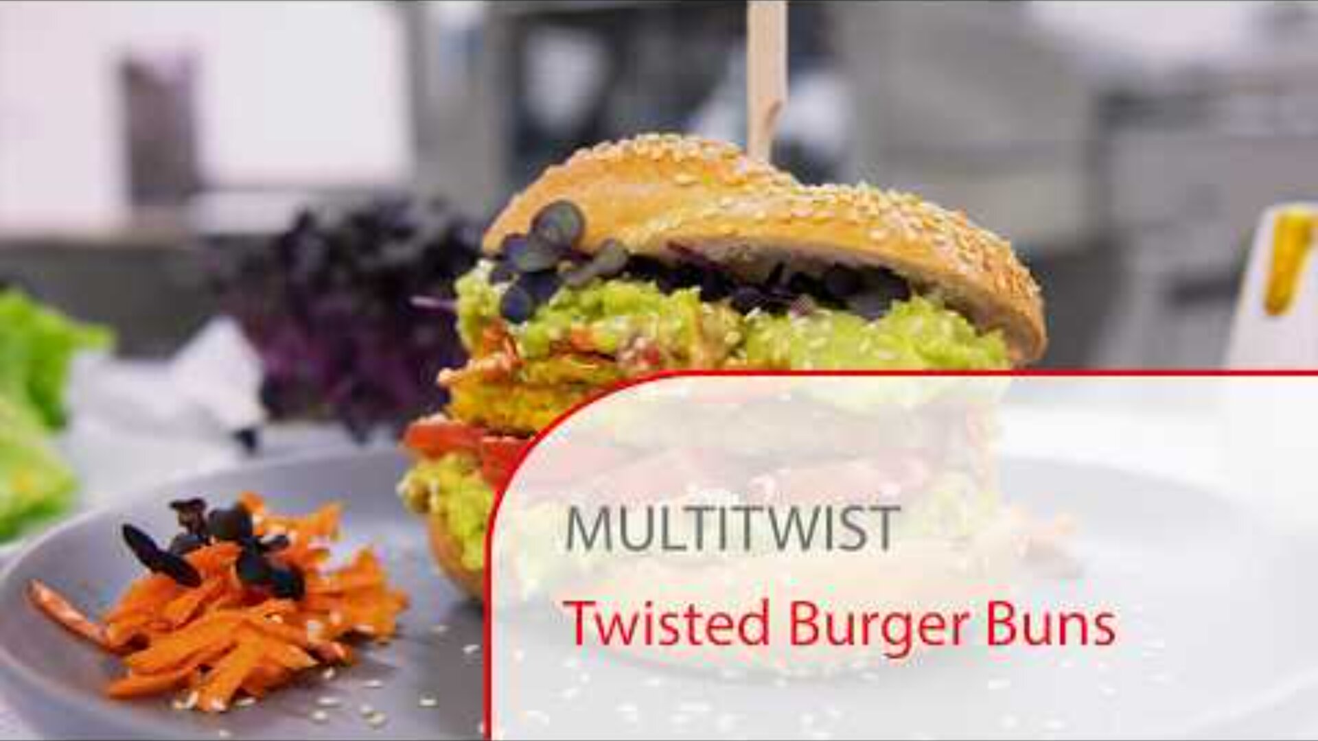 A sesame-topped burger bun twists around a colorful veggie burger with guacamole, tomato, and greens, served with shredded carrots on a plate. Text overlay reads: MULTITWIST Twisted Burger Buns.