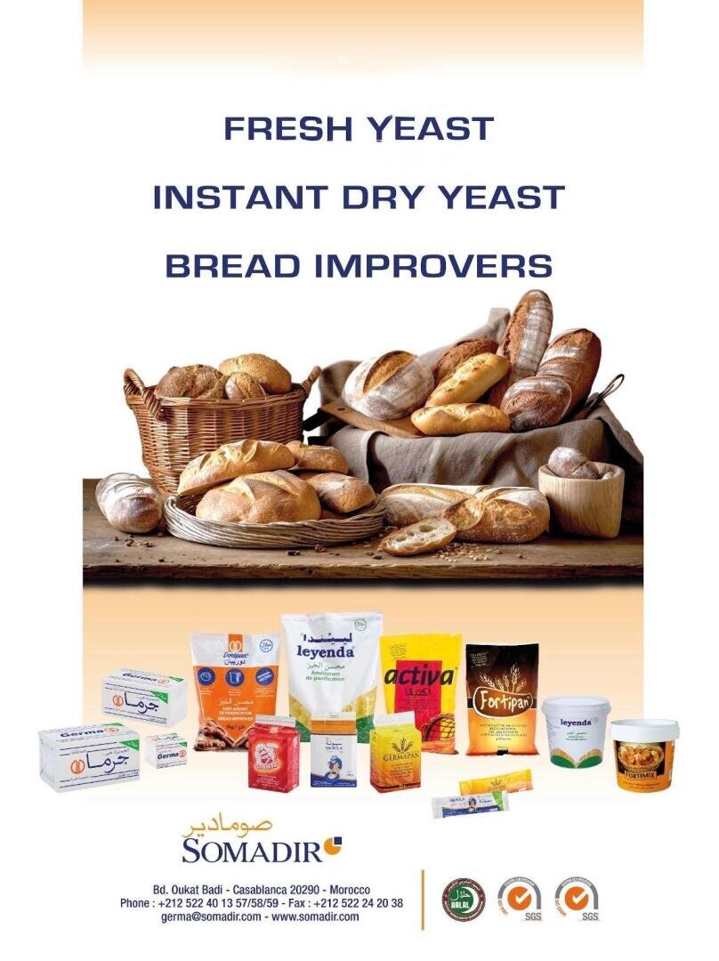 Eine Auswahl an Broten in Körben und auf Tabletts wird über verschiedenen Hefe- und Brotverbesserungsprodukten von SOMADIR angezeigt, mit Firmenkontaktinformationen und Logos am unteren Rand.