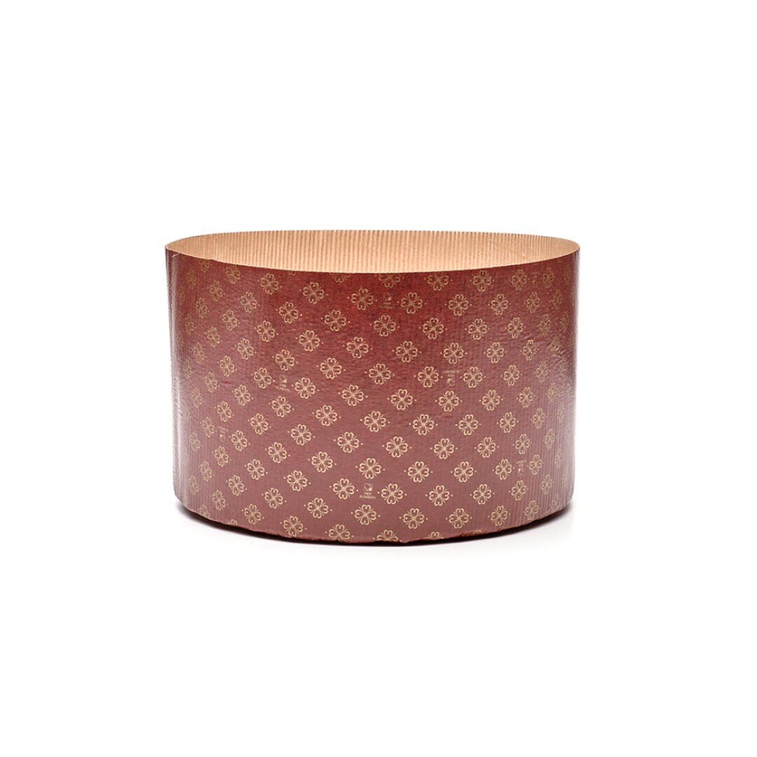 A round, tall, brown paper baking mold with a gold floral pattern, open at the top, used for baking items like panettone or other cakes.