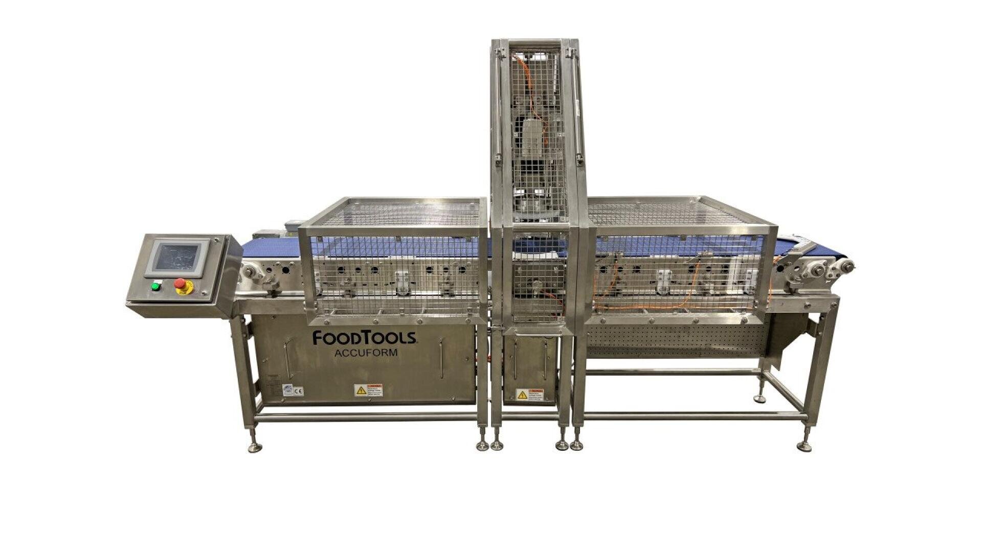 Eine FoodTools AccuForm Lebensmittelverarbeitungsmaschine aus rostfreiem Stahl mit Bedienfeld, Förderbändern und Schutzgitter, die für die automatisierte Lebensmittelproduktion konzipiert ist.