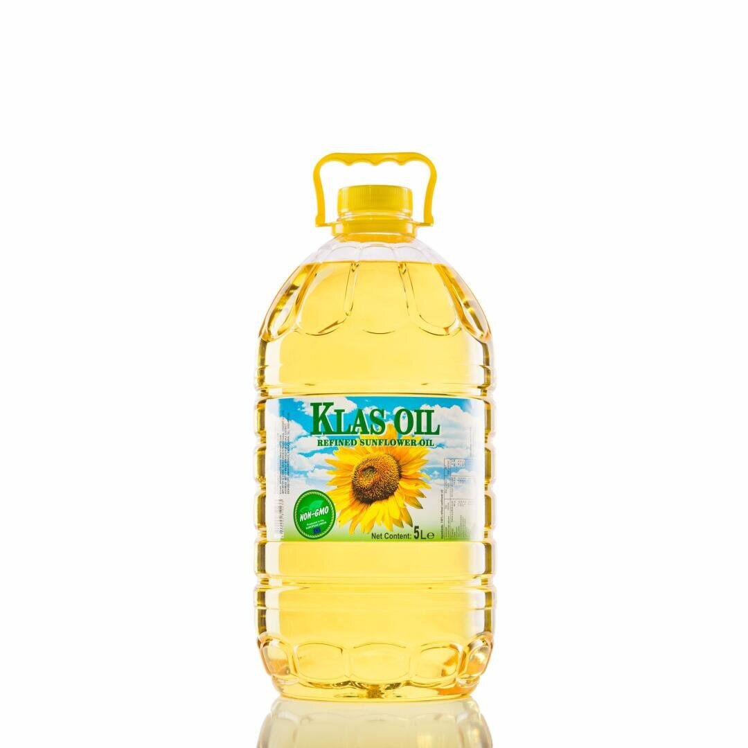 A 5-liter plastic bottle of Klas Oil blended sunflower oil with a yellow handle. The label features a sunflower image and blue sky background. The bottle is filled with clear yellow oil and placed on a white background.