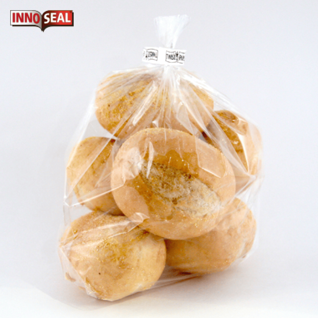 A clear plastic bag filled with round bread rolls, sealed at the top with a twist tie labeled InnoSeal, against a plain white background.
