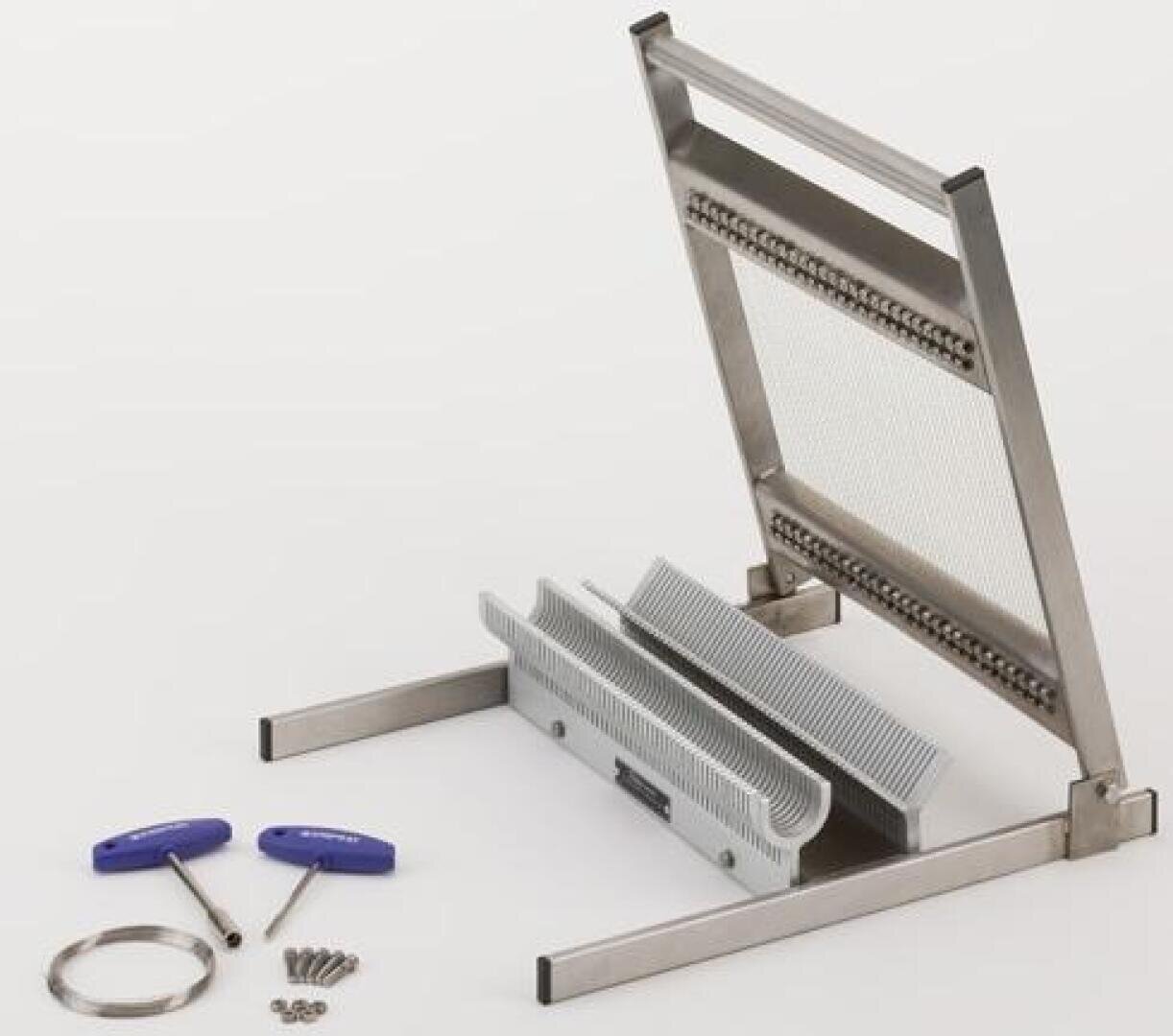 A metal wire grid cutter with a handle, gray comb-like inserts, two blue-handled tools, screws, and a metal ring, all laid out on a white surface.