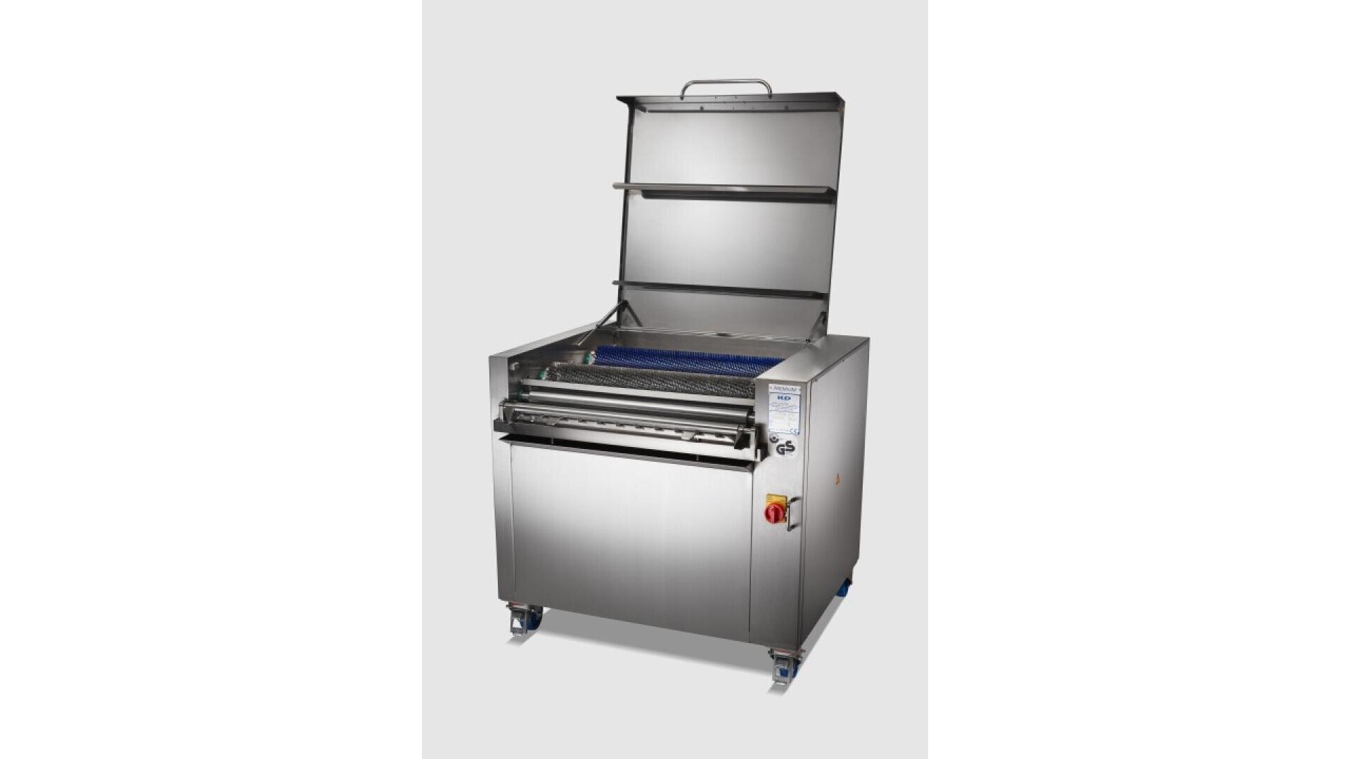 A stainless steel industrial cleaning machine with an open lid, control panel, and caster wheels, shown against a plain light background.