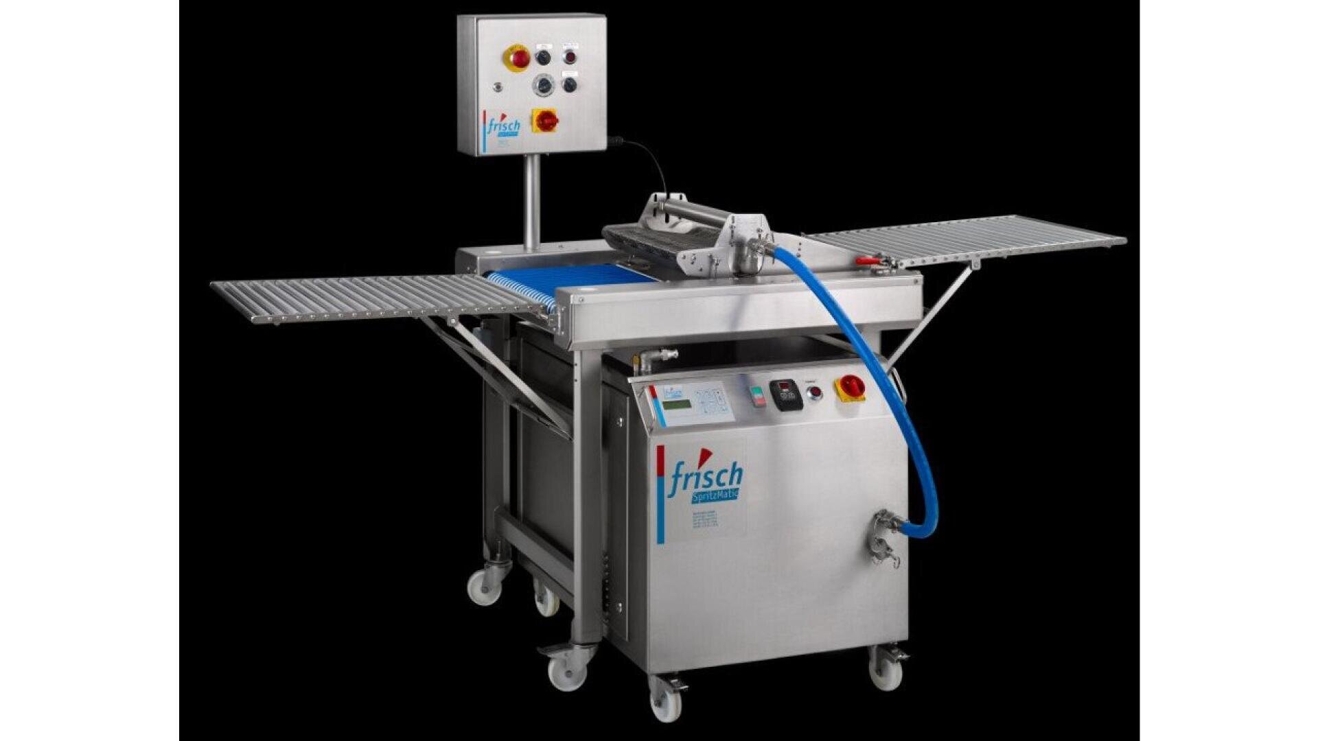 A stainless steel industrial food processing machine with conveyor belts, control panels, and the Frisch logo, designed for automated bakery or pastry production, set against a black background.