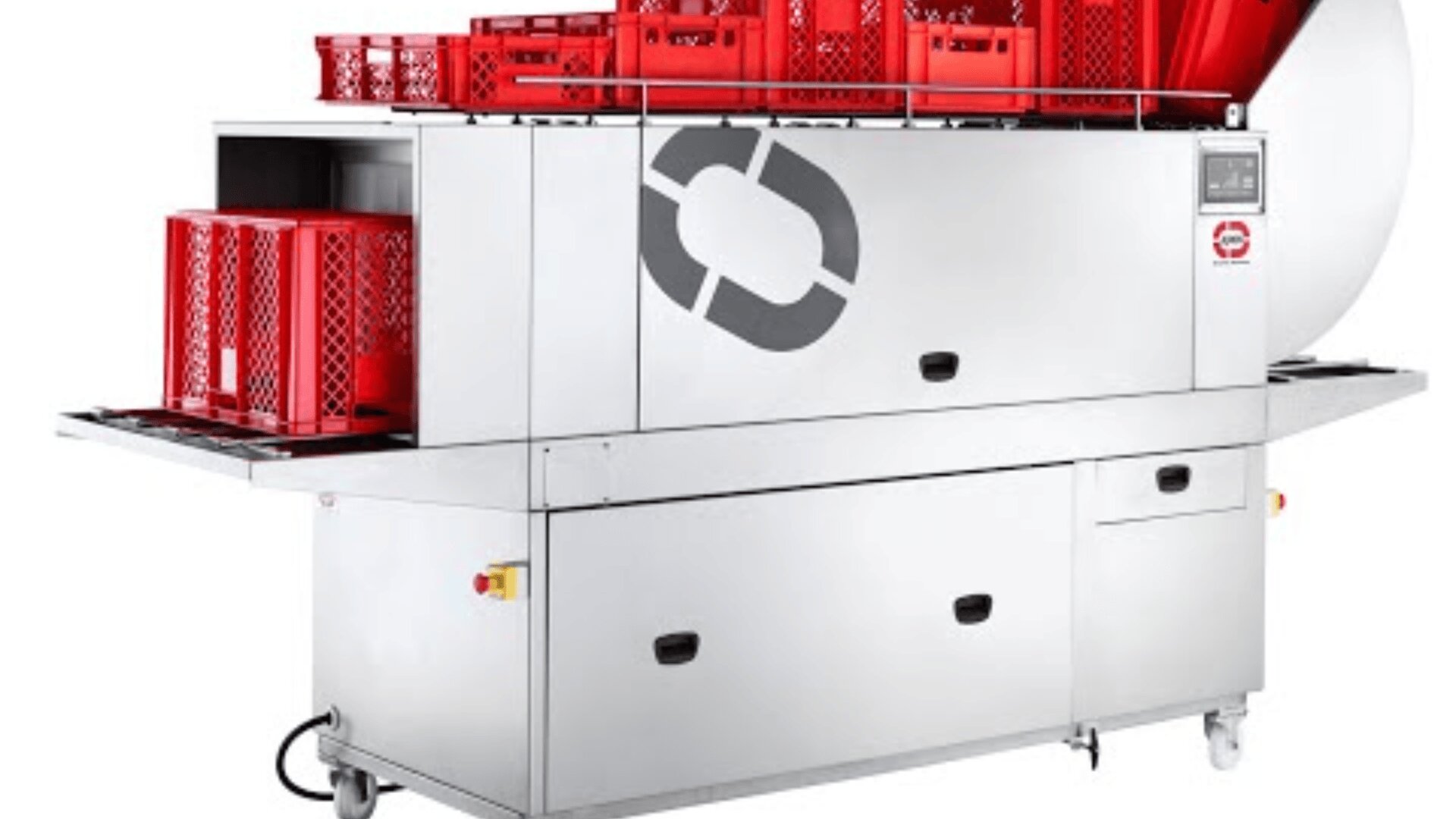 A commercial crate washer with red plastic crates on top and entering the machine, featuring a stainless steel exterior and control panel on the right side.