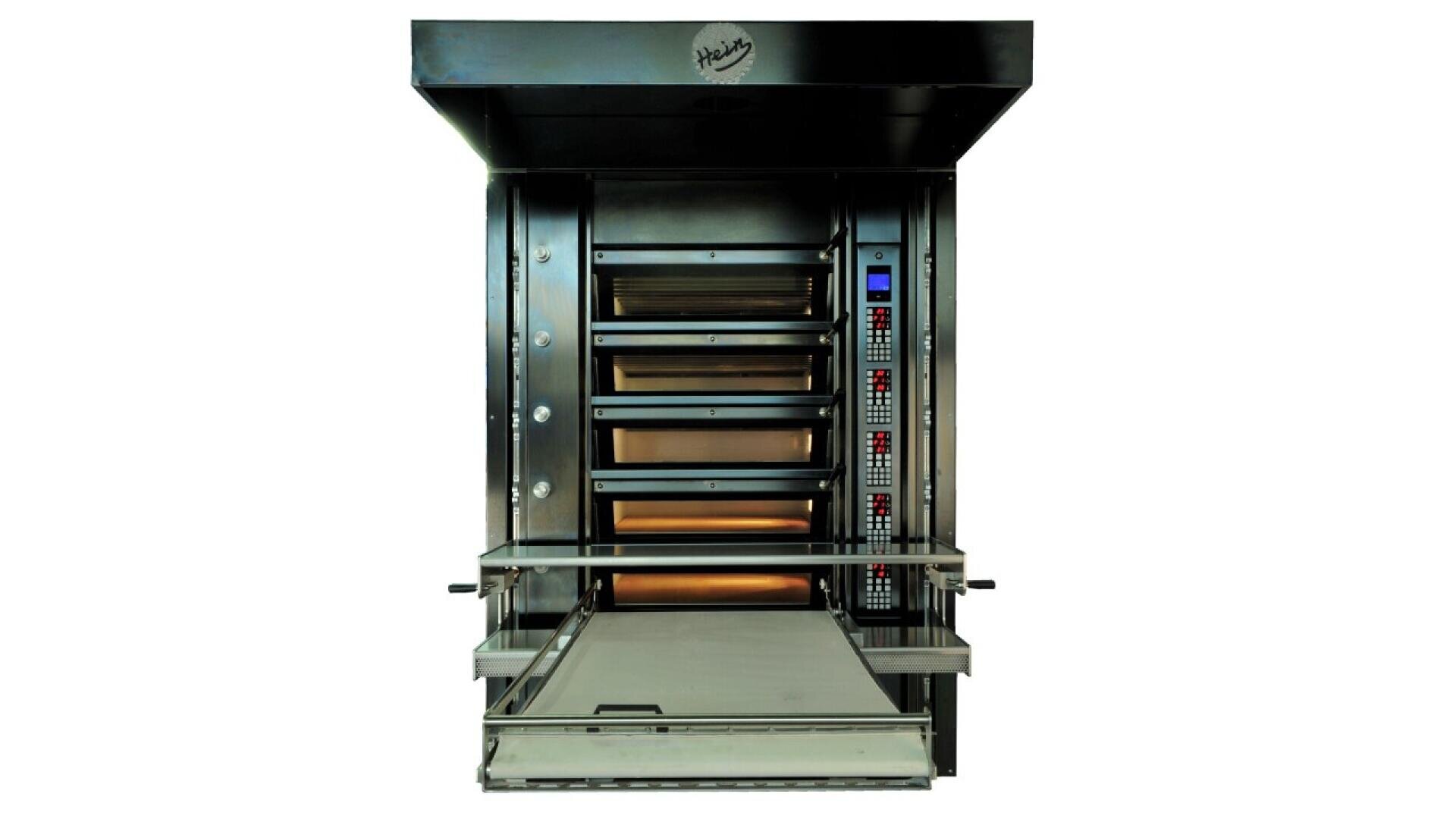 A large commercial bakery oven with four stacked baking chambers, digital control panels on the right side, and an extended conveyor tray at the front. The oven is metallic and industrial in appearance.