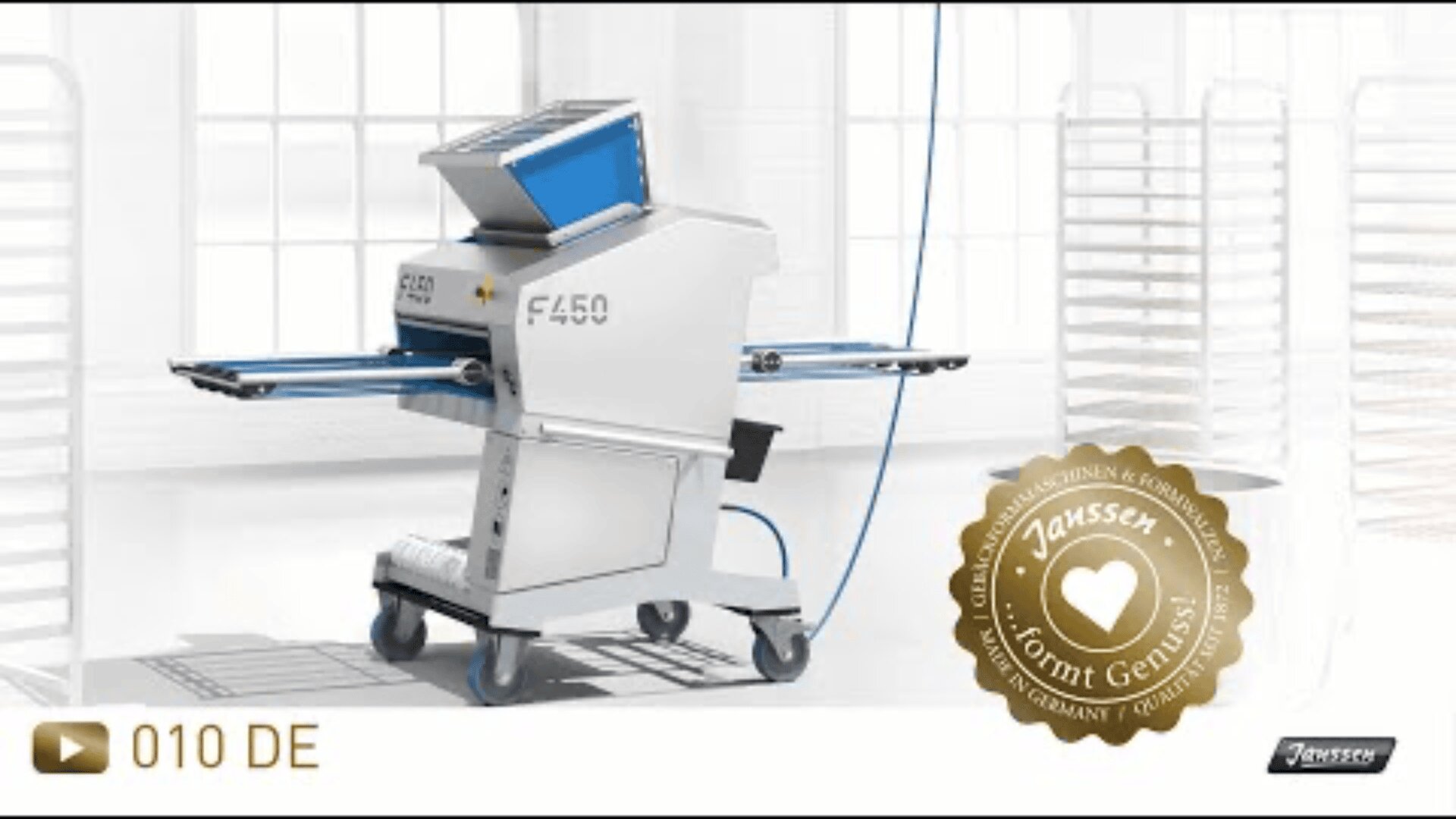 A commercial dough sheeter machine labeled F450 stands in a bright industrial kitchen with racks in the background. A gold Janssen quality seal is displayed at the bottom right.