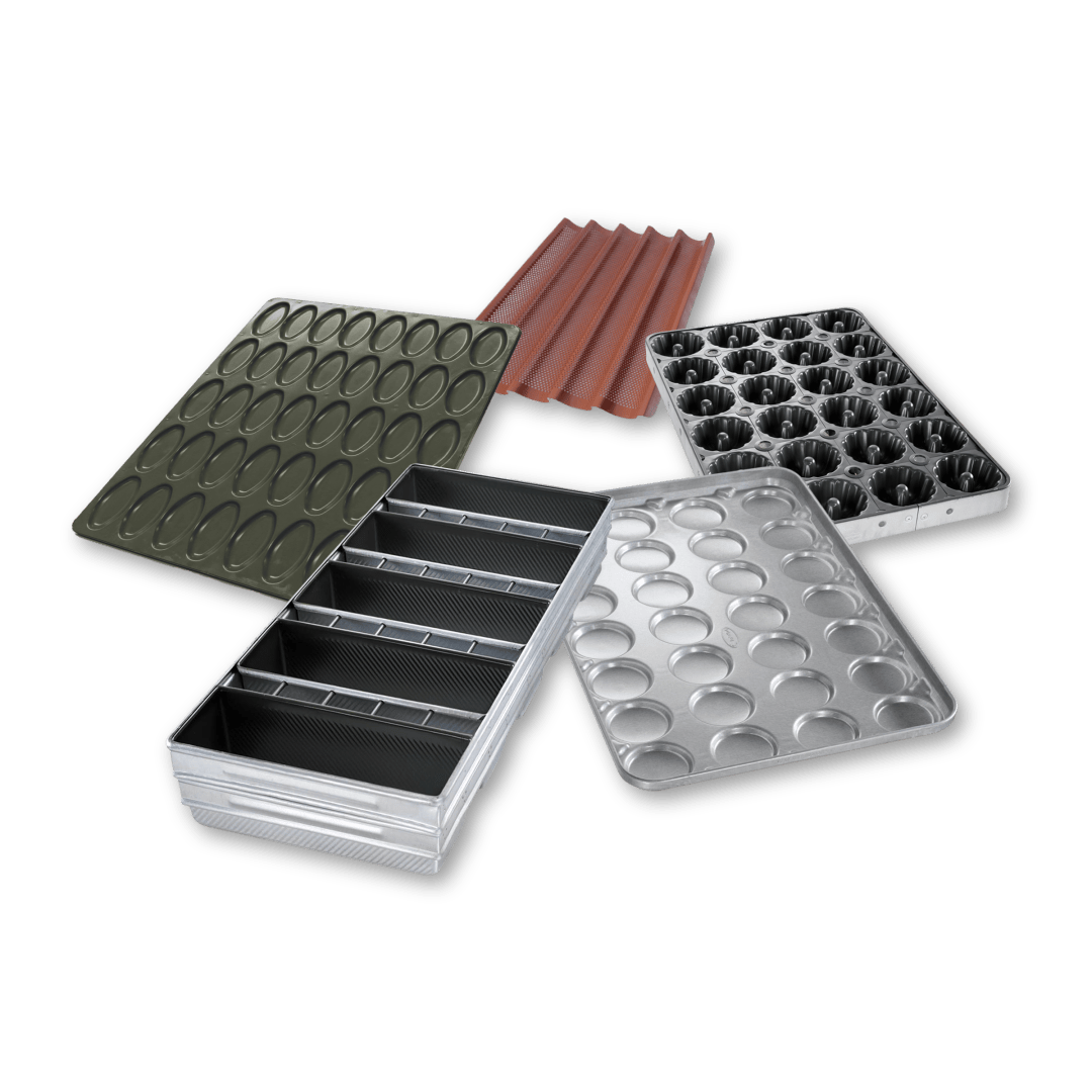 Five different commercial baking trays and molds in various shapes and sizes, including rounded and rectangular cavities, arranged on a black background.
