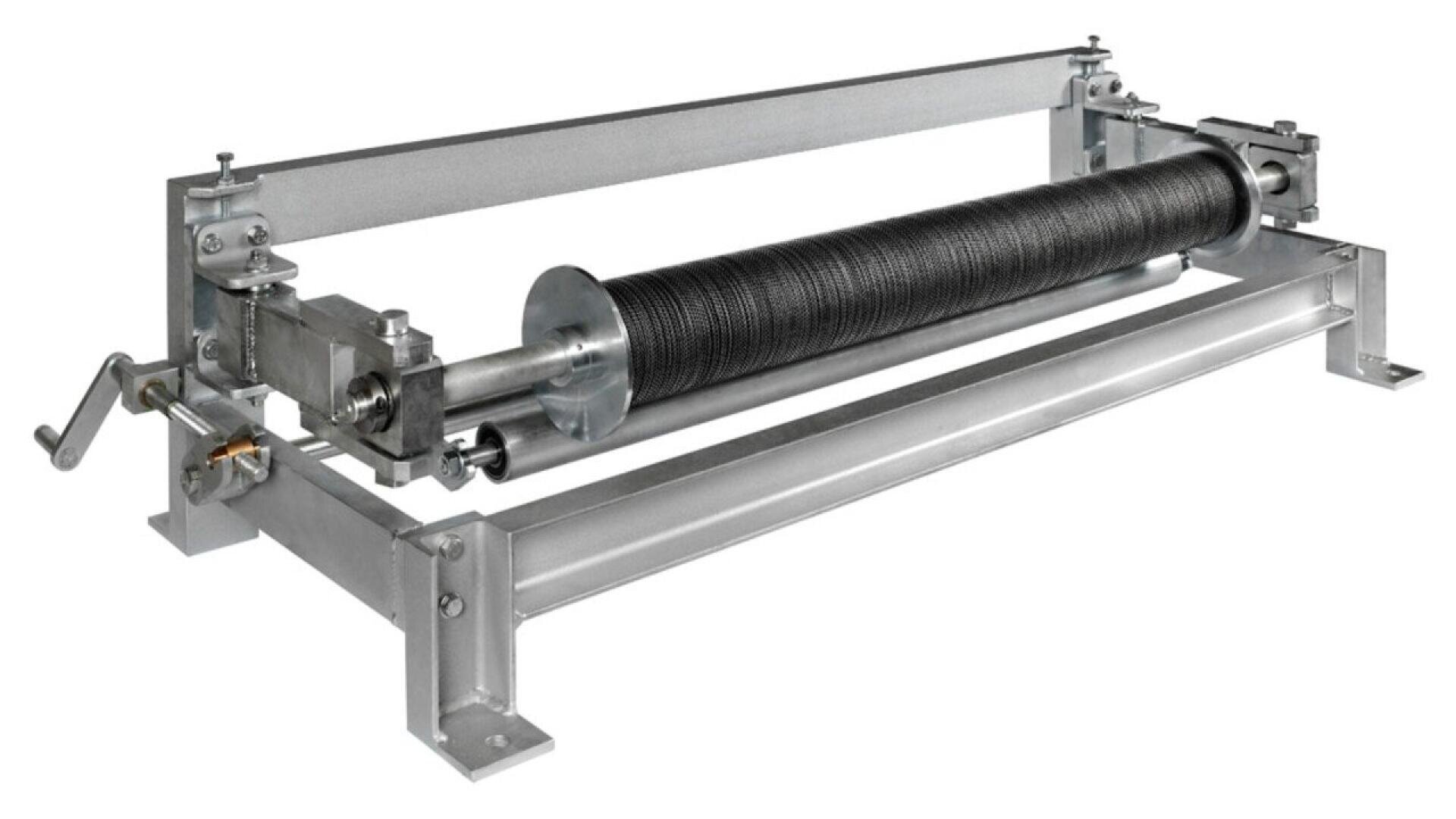 A metal wire winding machine with a hand crank, featuring a cylindrical spool wrapped with wire, supported by a sturdy rectangular metal frame.